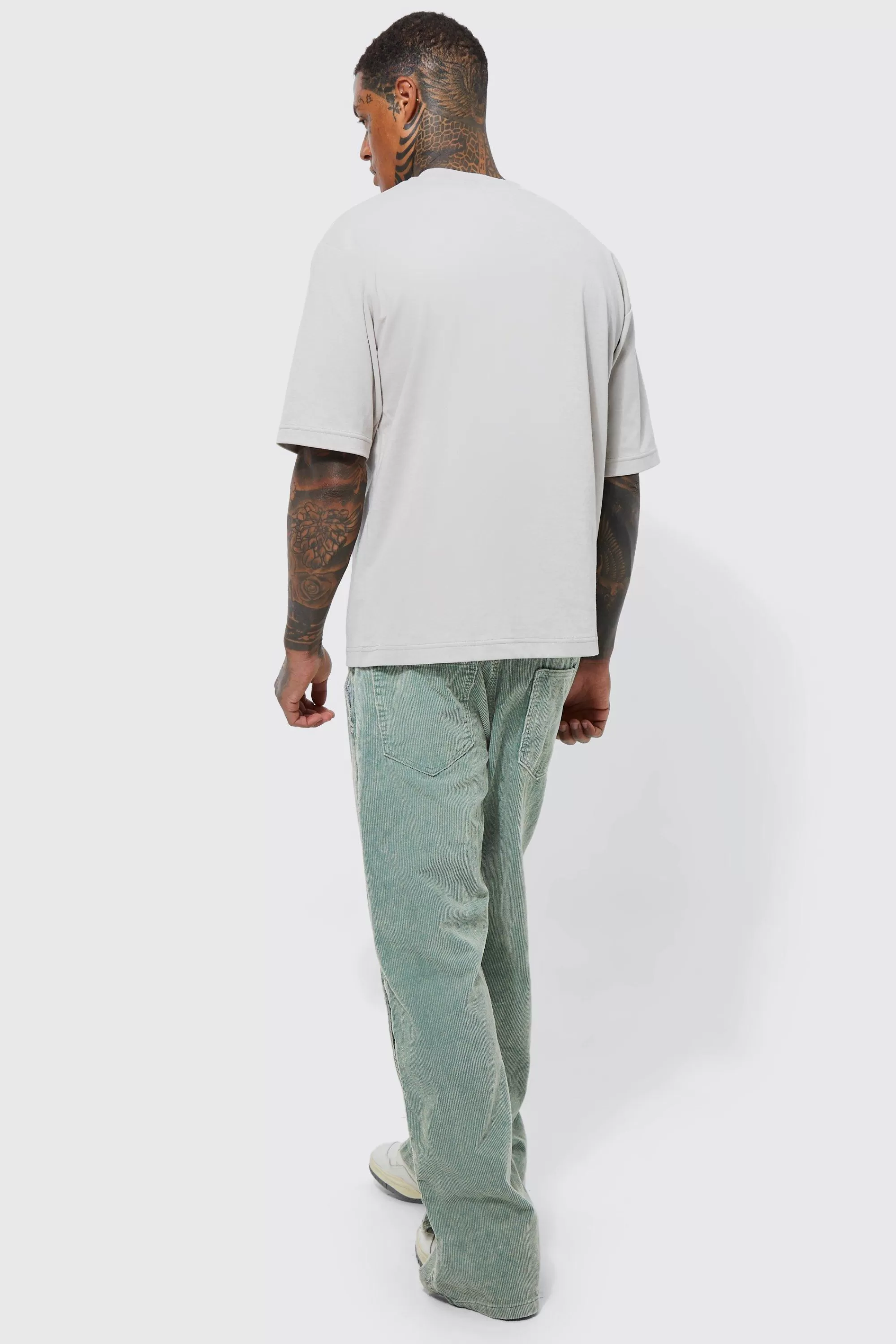 boohooMAN Acid Wash Relaxed Fit Popper Corduroy Trousers | UK