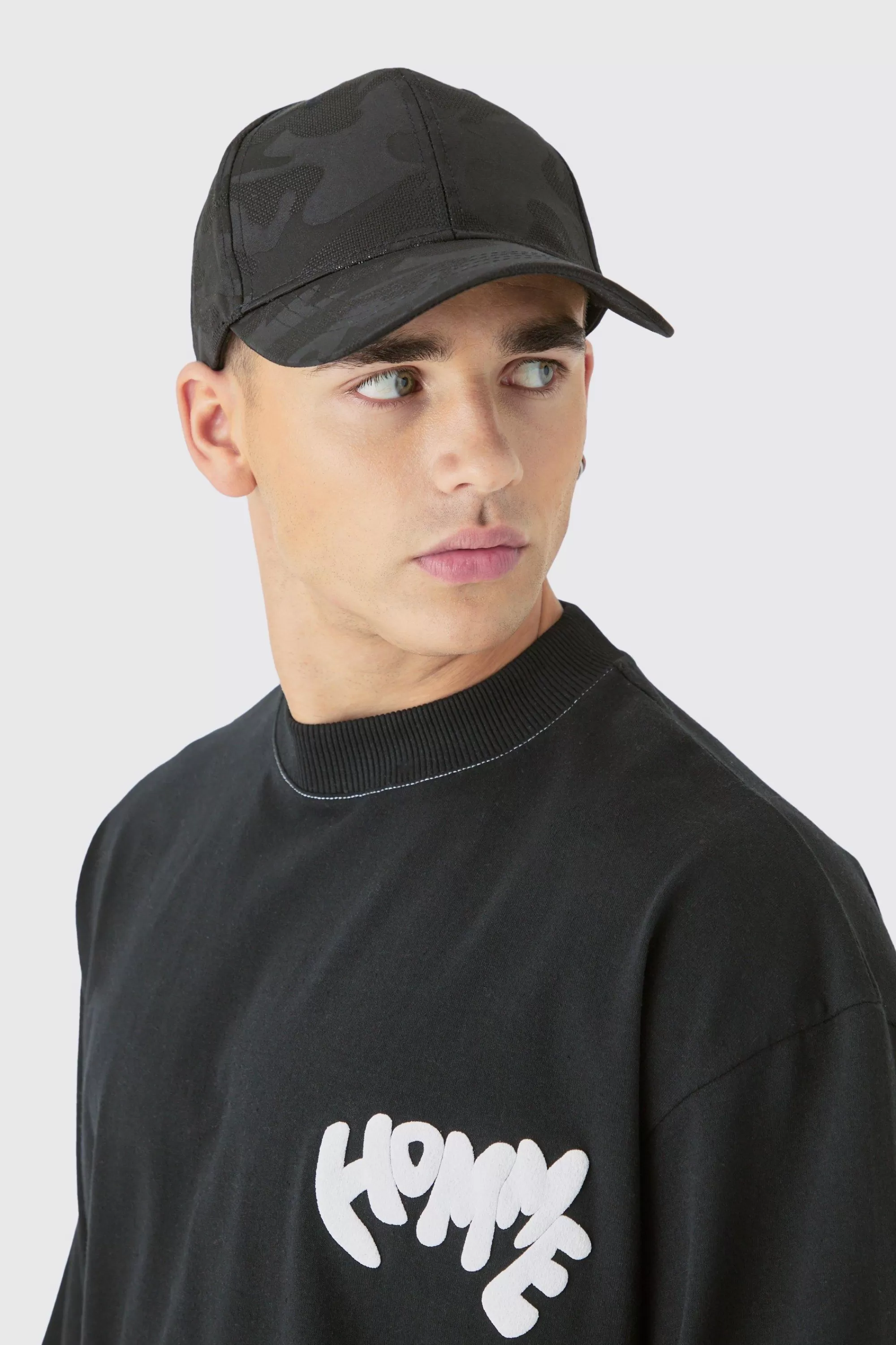 boohooMAN All Over Camo Print Cap In | UK