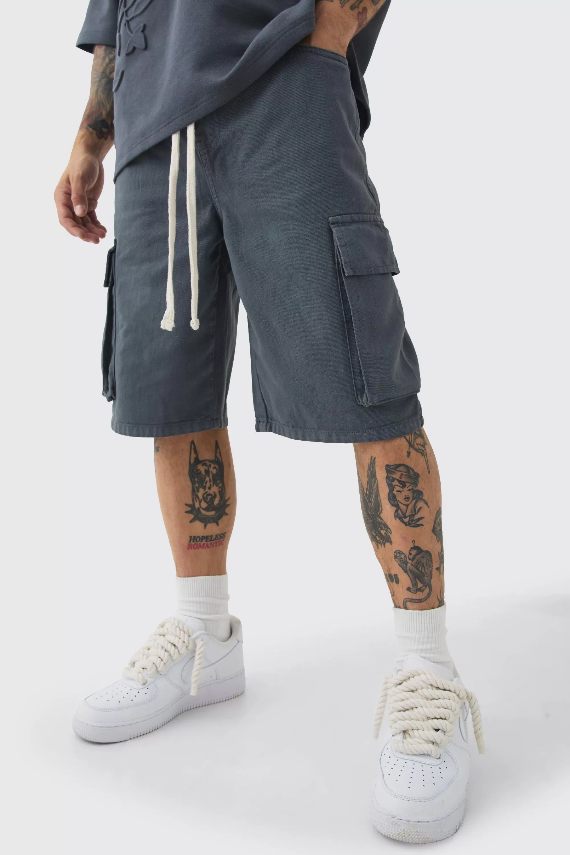 boohooMAN Baggy Fit Elasticated Waist Extended Drawcord Cargo Shorts | UK