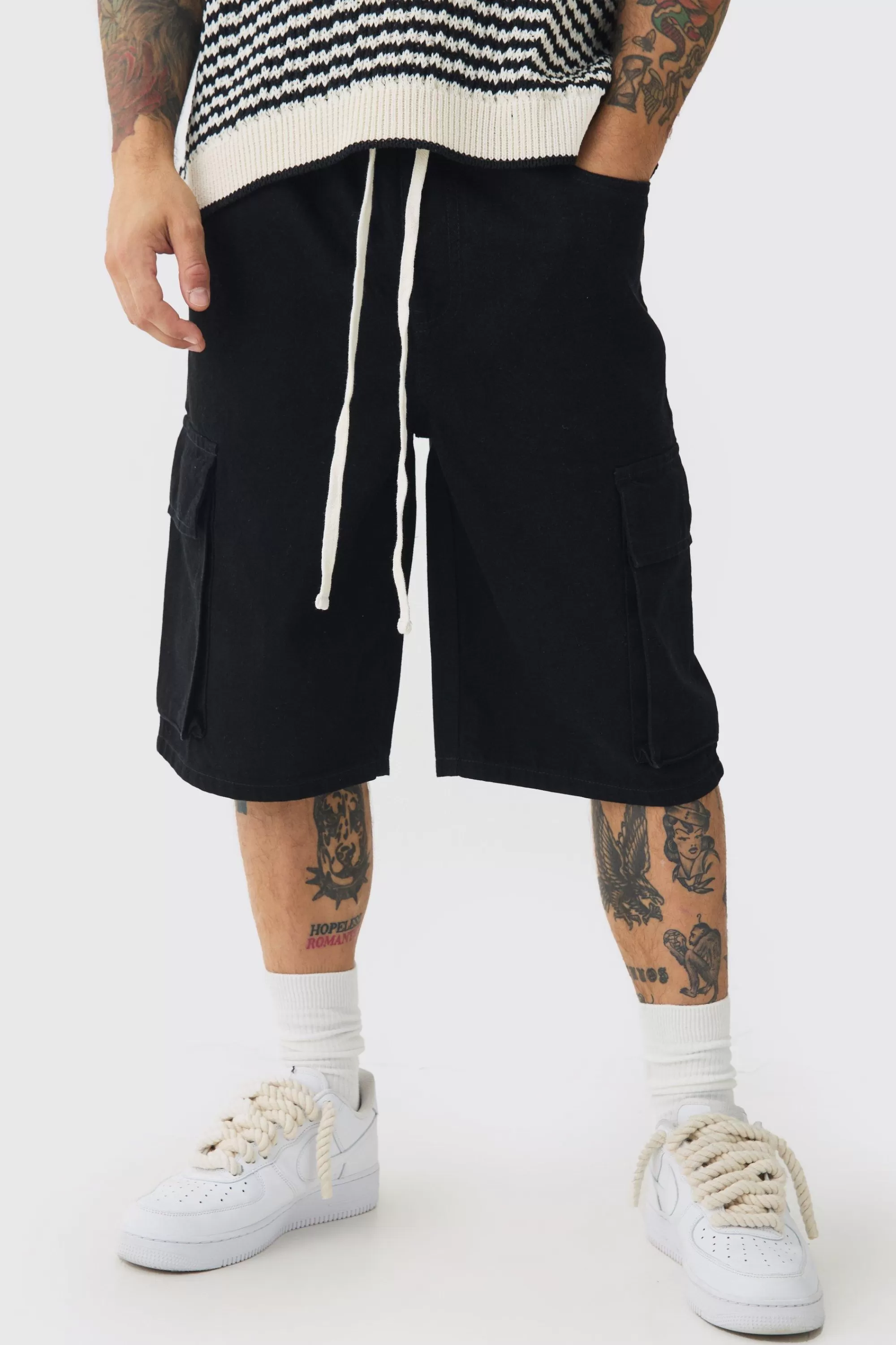 boohooMAN Baggy Fit Elasticated Waist Extended Drawcord Cargo Shorts | UK