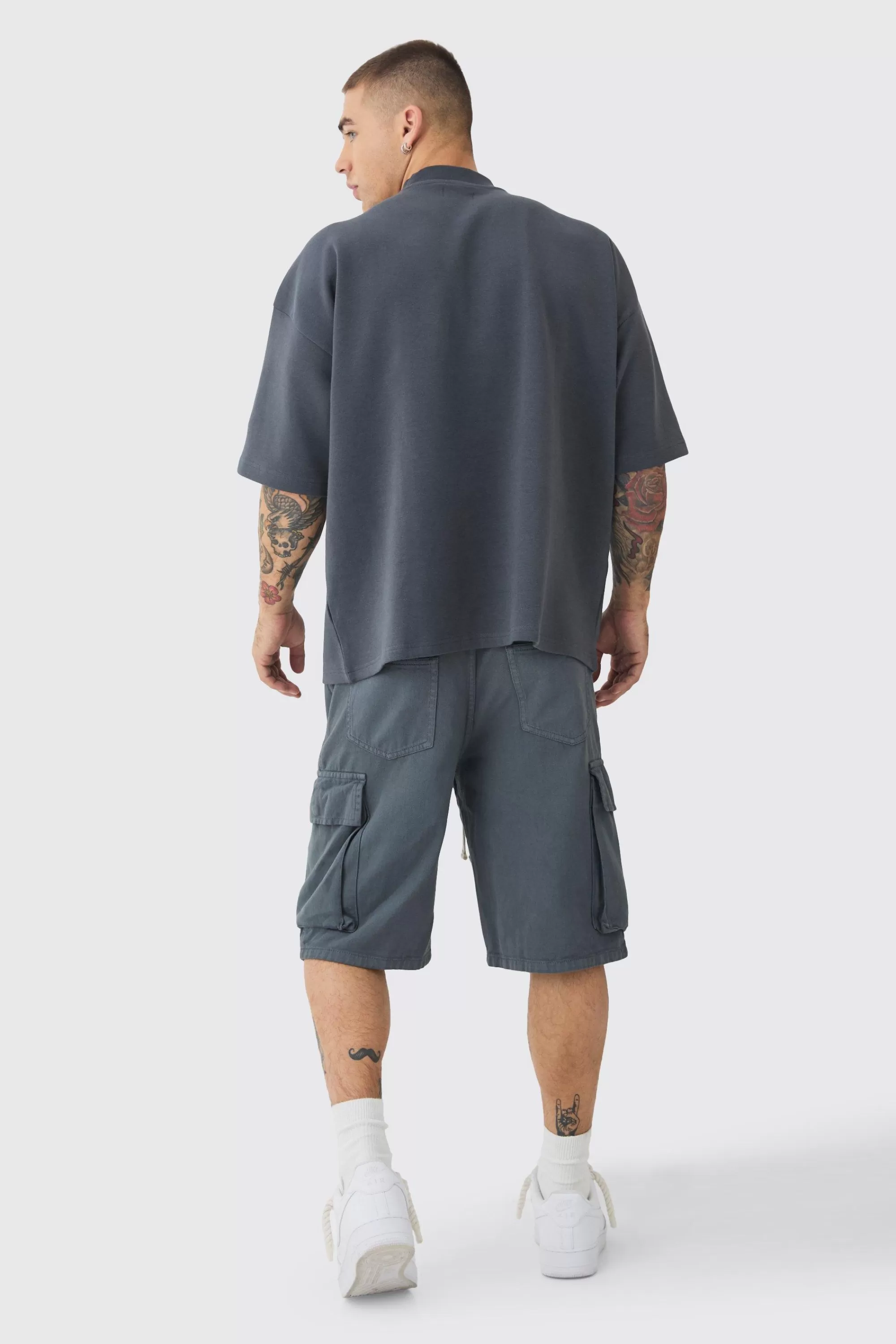 boohooMAN Baggy Fit Elasticated Waist Extended Drawcord Cargo Shorts | UK