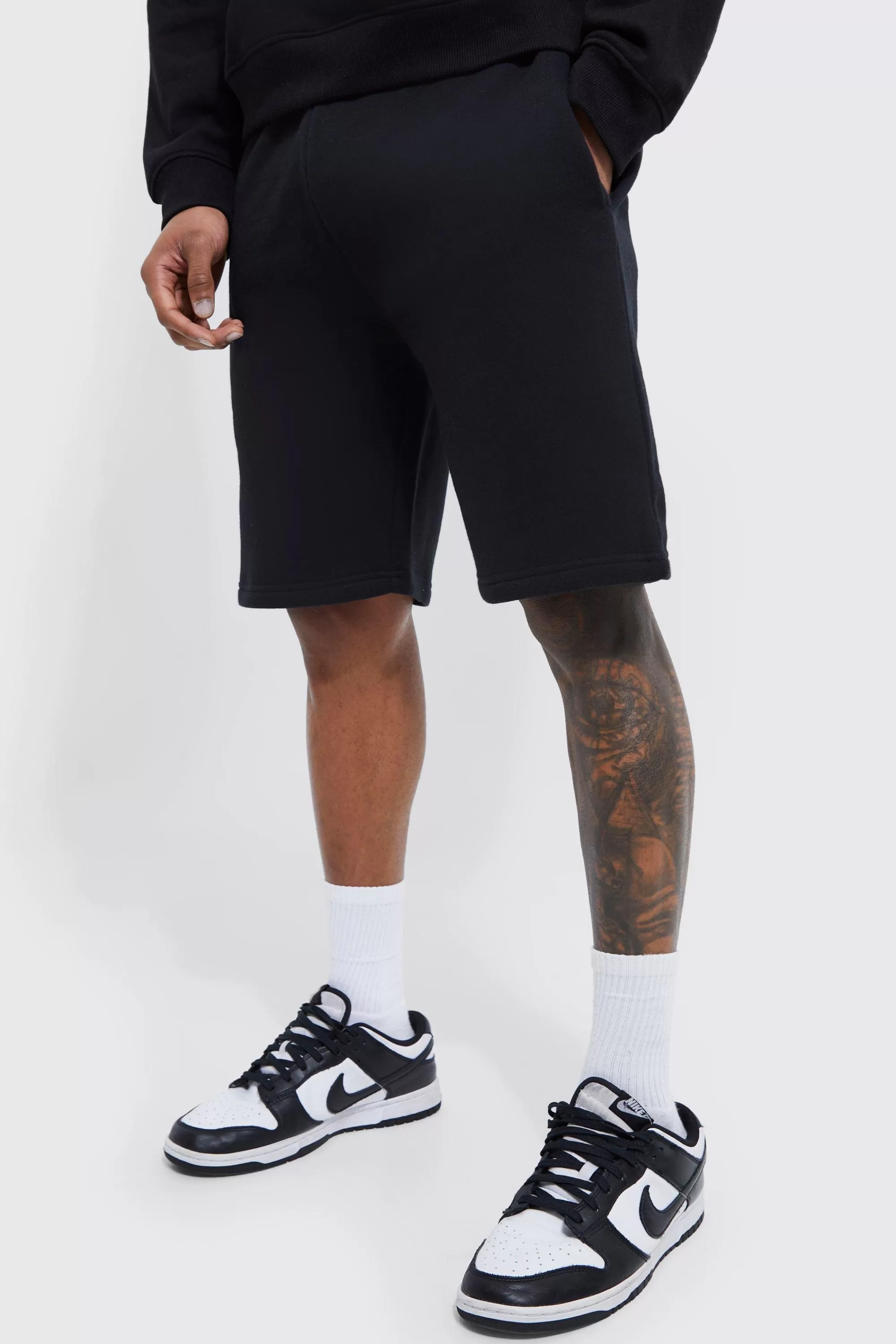 boohooMAN Basic Loose Fit Mid Length Jersey Short | UK
