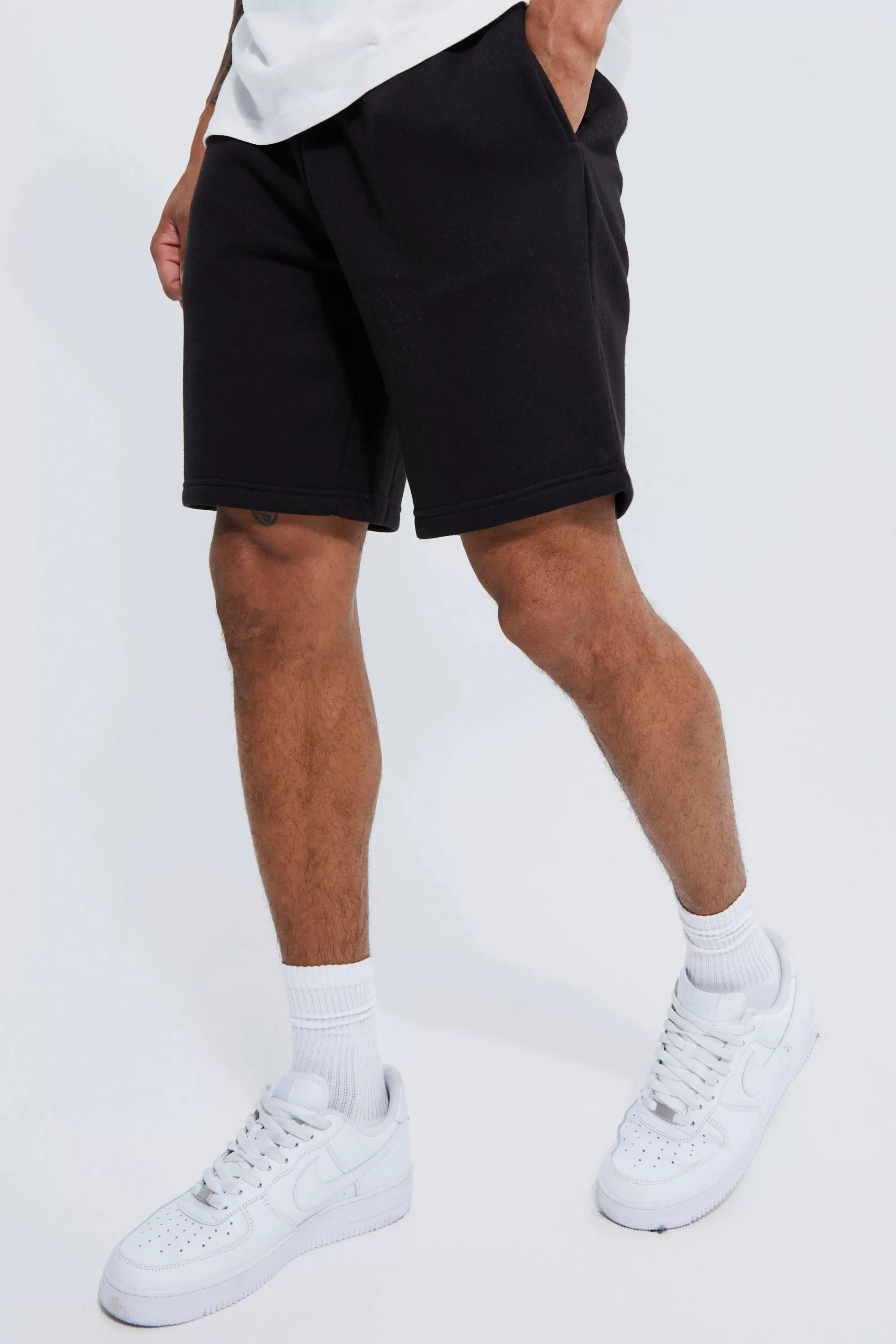 boohooMAN Basic Loose Fit Mid Length Jersey Short | UK