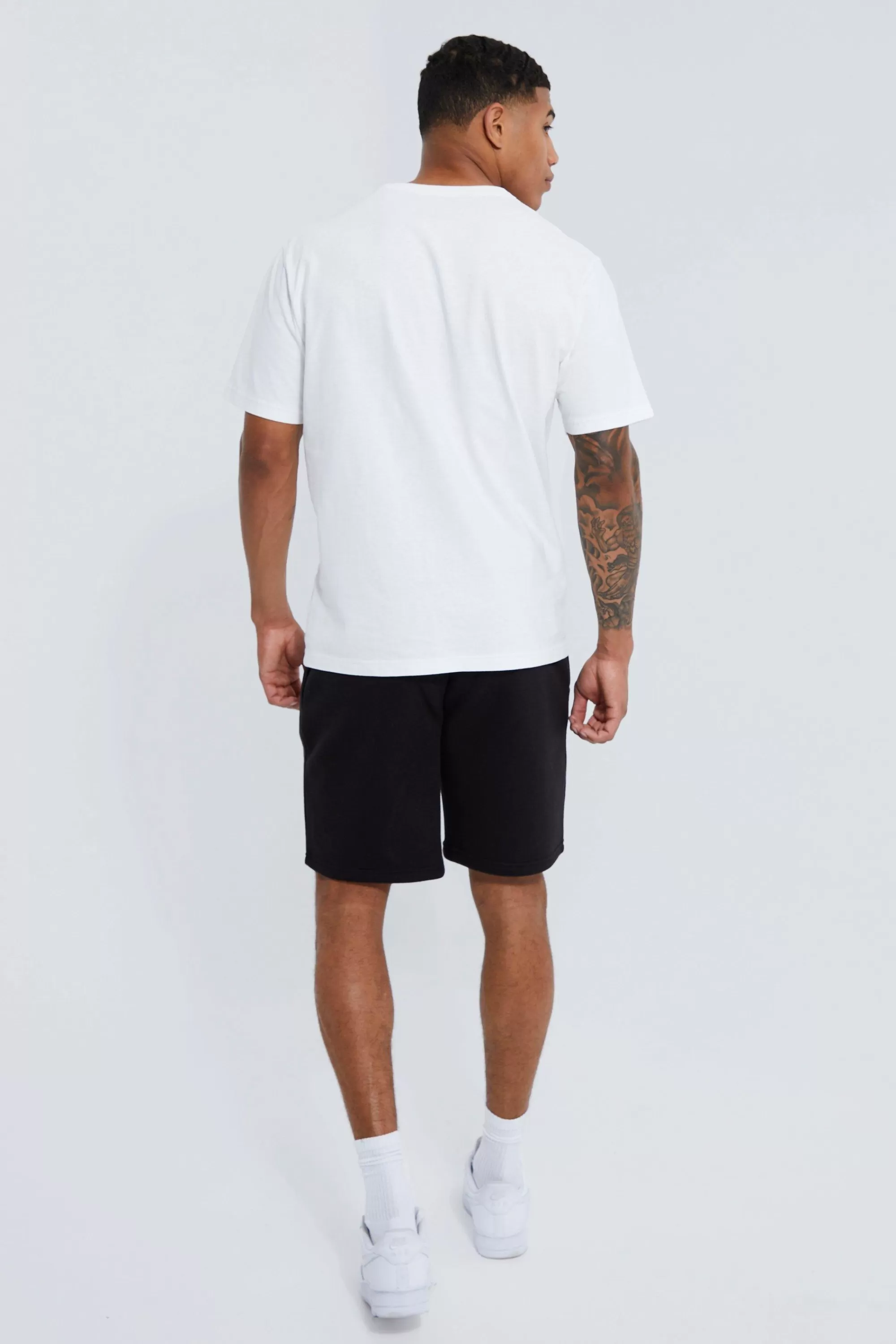 boohooMAN Basic Loose Fit Mid Length Jersey Short | UK