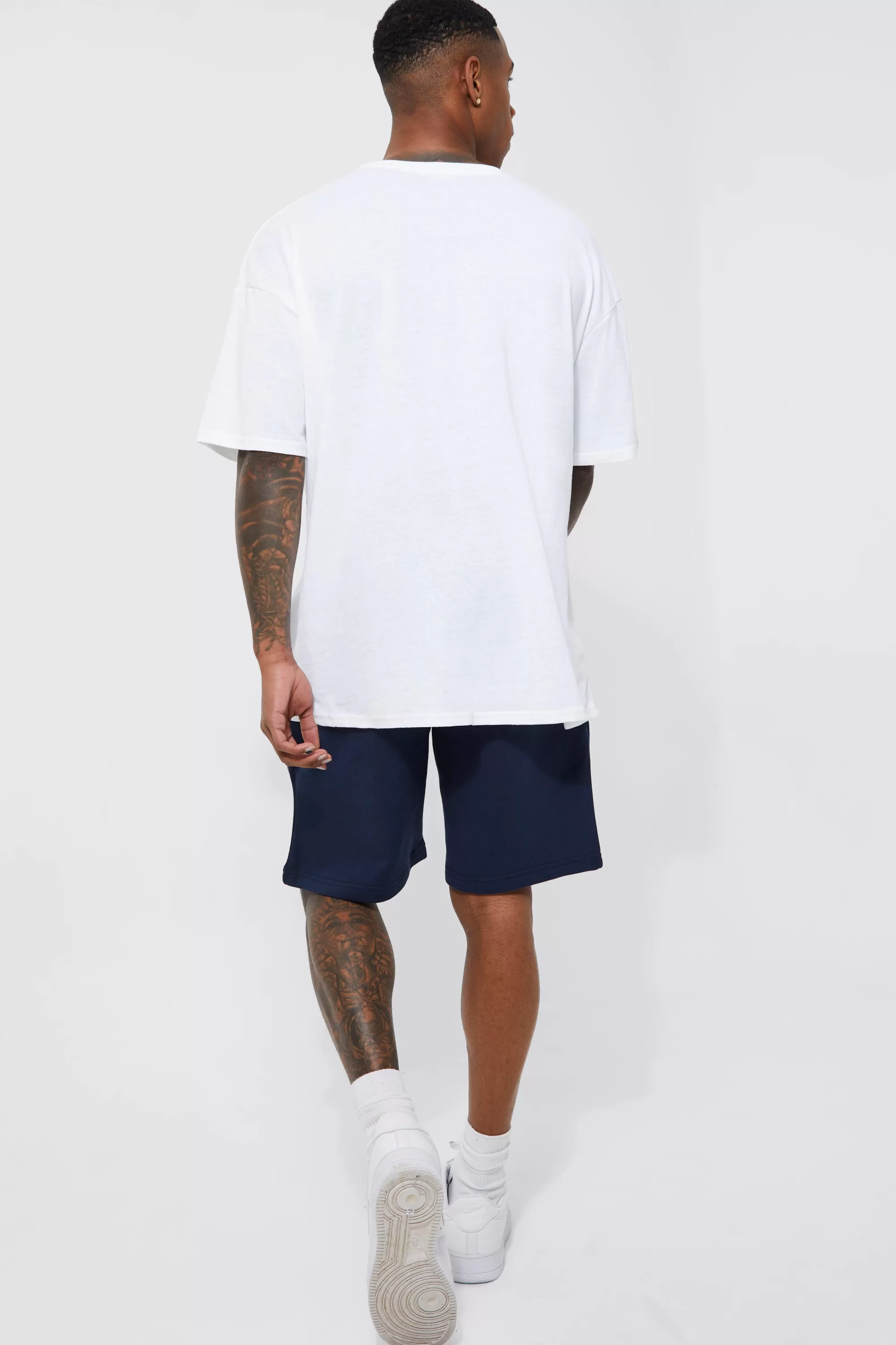 boohooMAN Basic Loose Fit Mid Length Jersey Short | UK