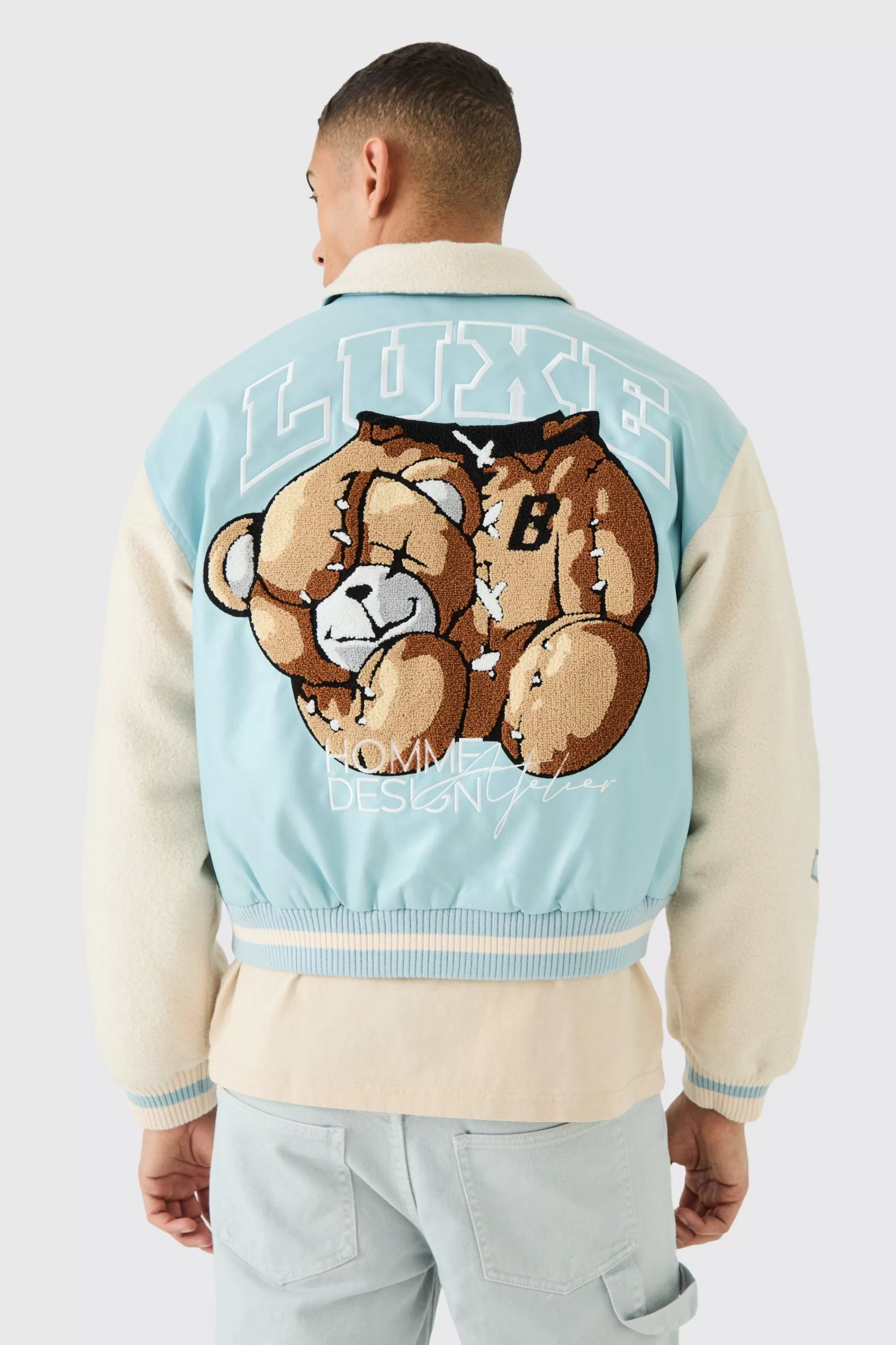 boohooMAN Boxy Teddy Varsity Jacket With Boucle Sleeves | UK