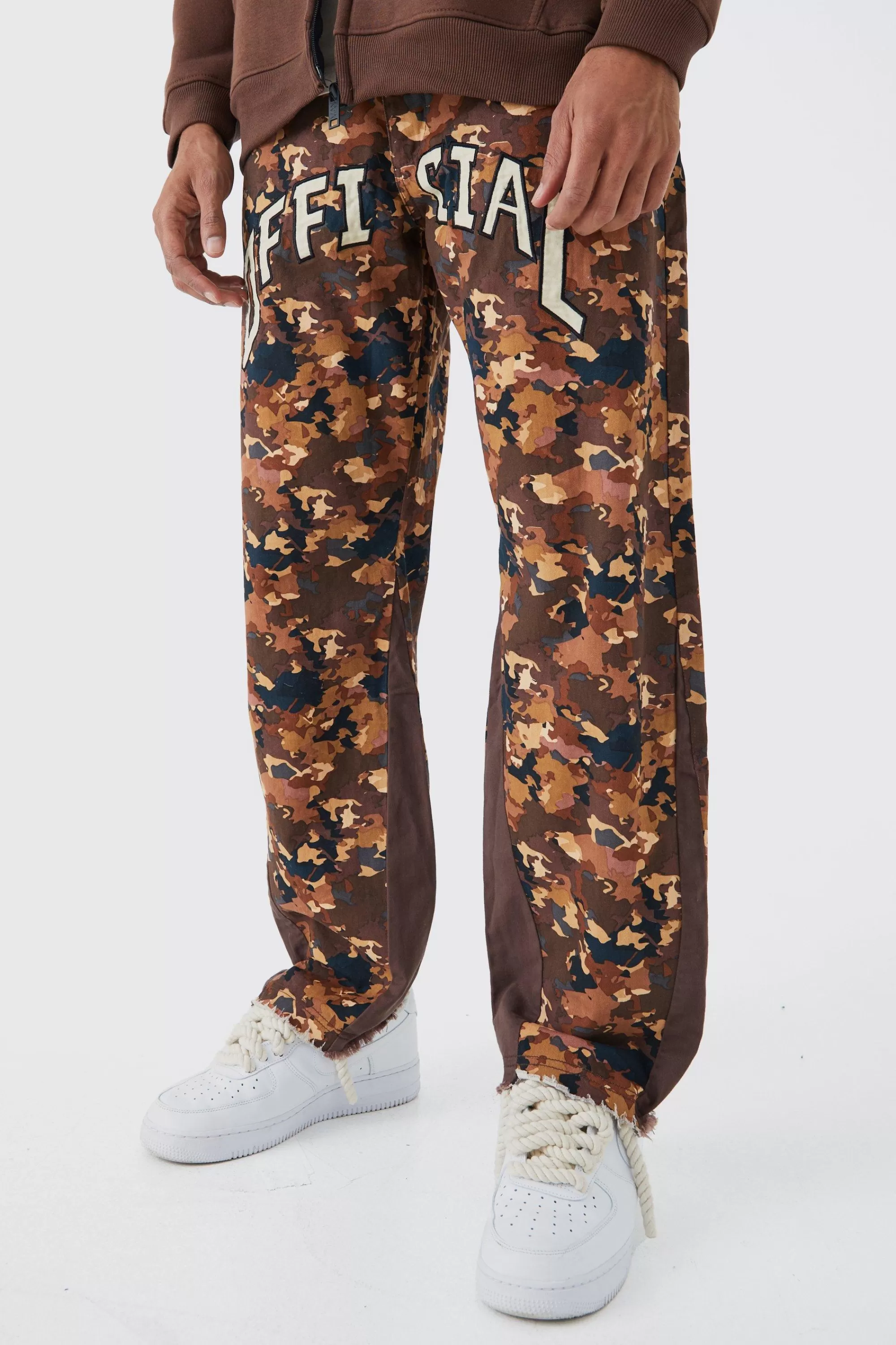 boohooMAN Camo Gusset Detail Official Applique Flared Trousers | UK