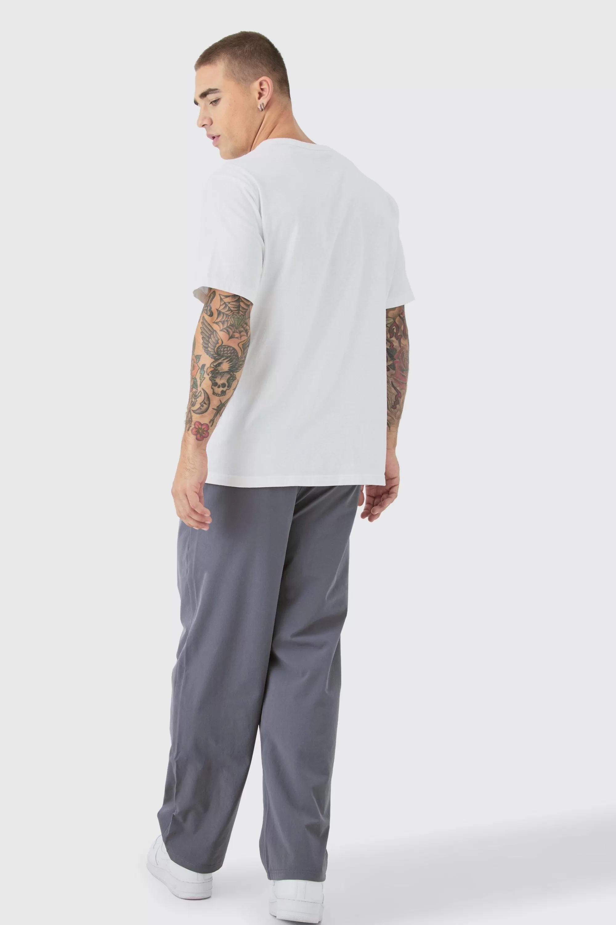 boohooMAN Elasticated Technical Stretch Relaxed Cropped Trouser | UK