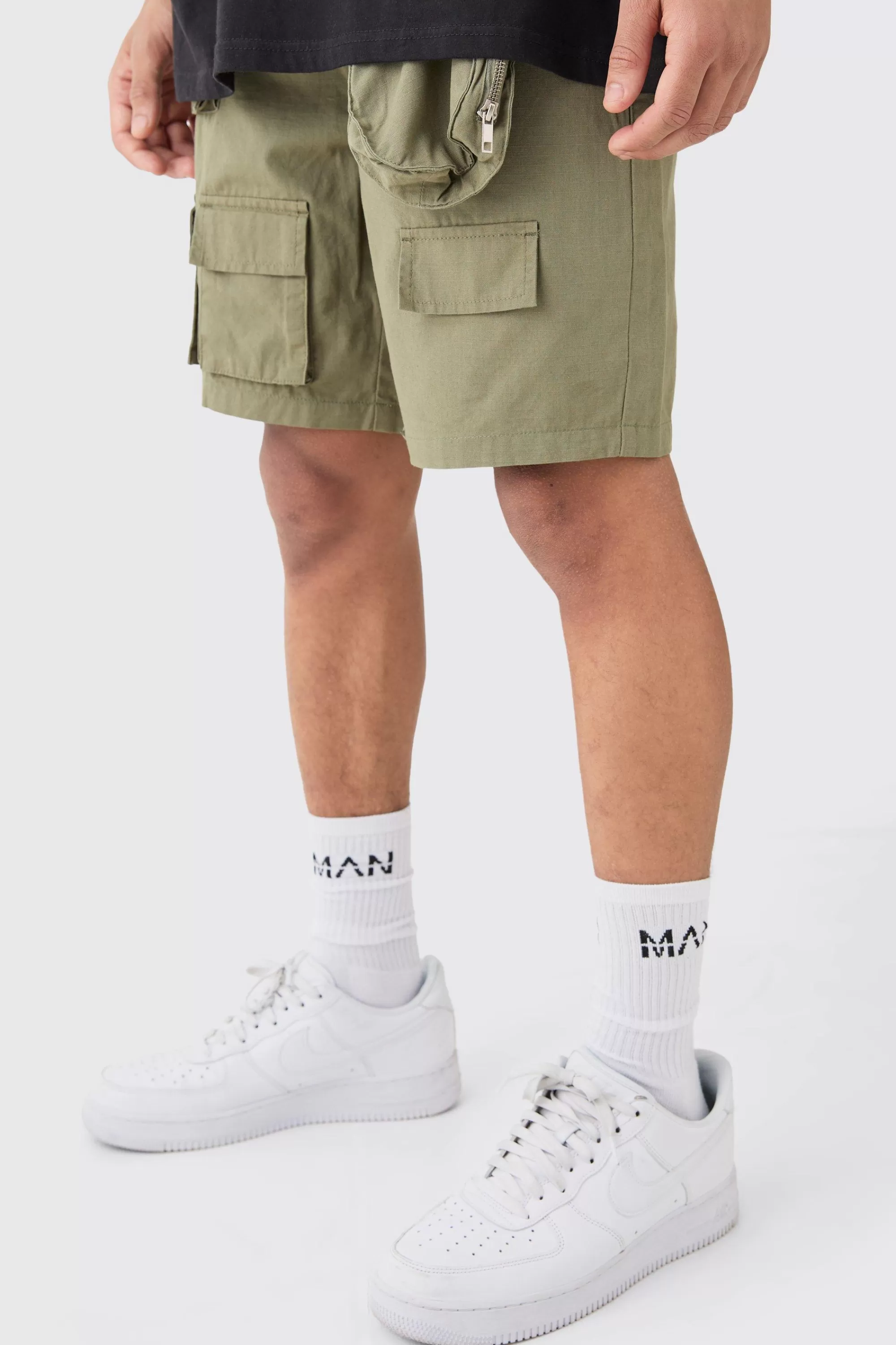 boohooMAN Elasticated Waist Detachable Bag Multi Cargo Pocket Shorts | UK