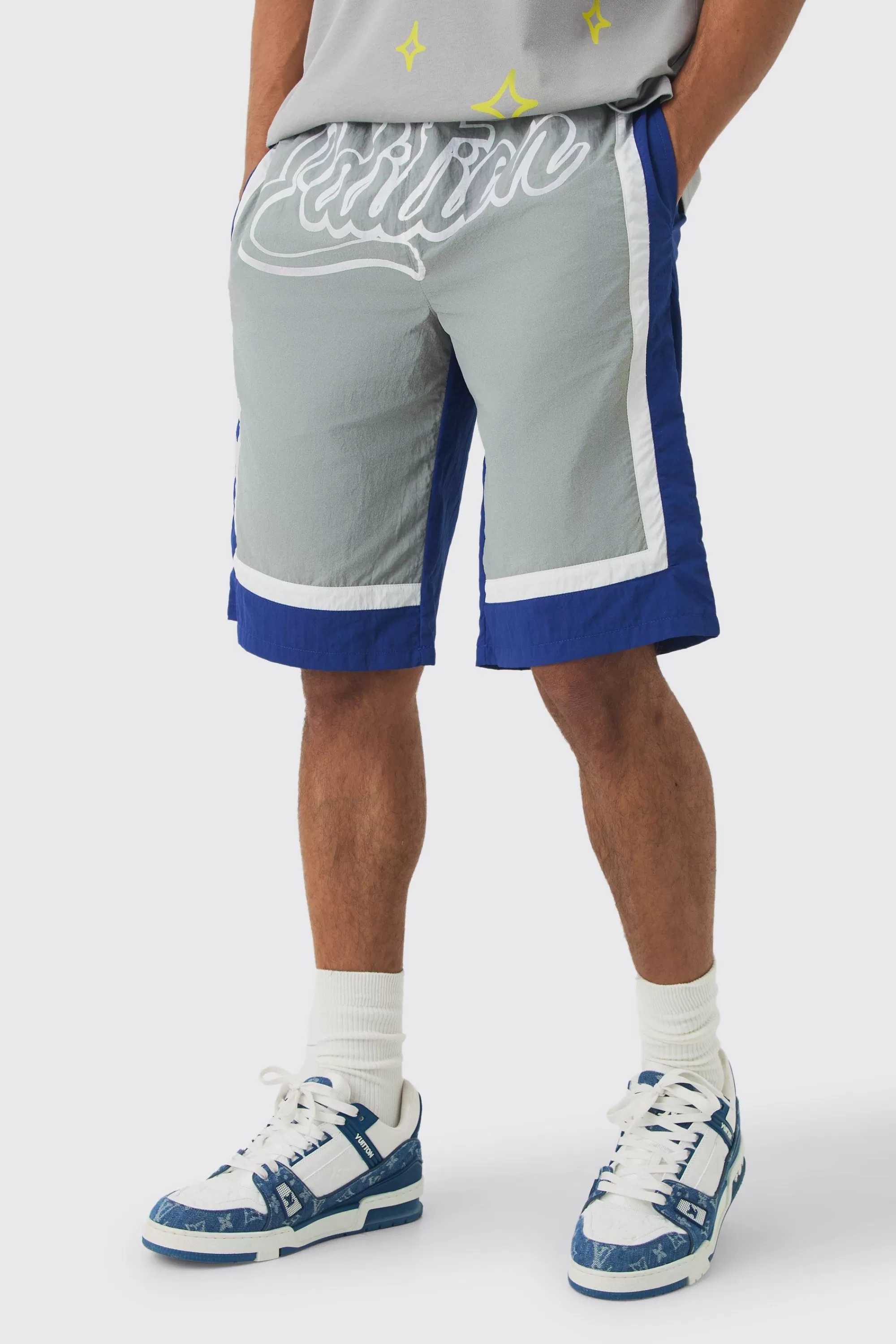 boohooMAN Elasticated Waist Limited Relaxed Longline Shell Panel Shorts | UK