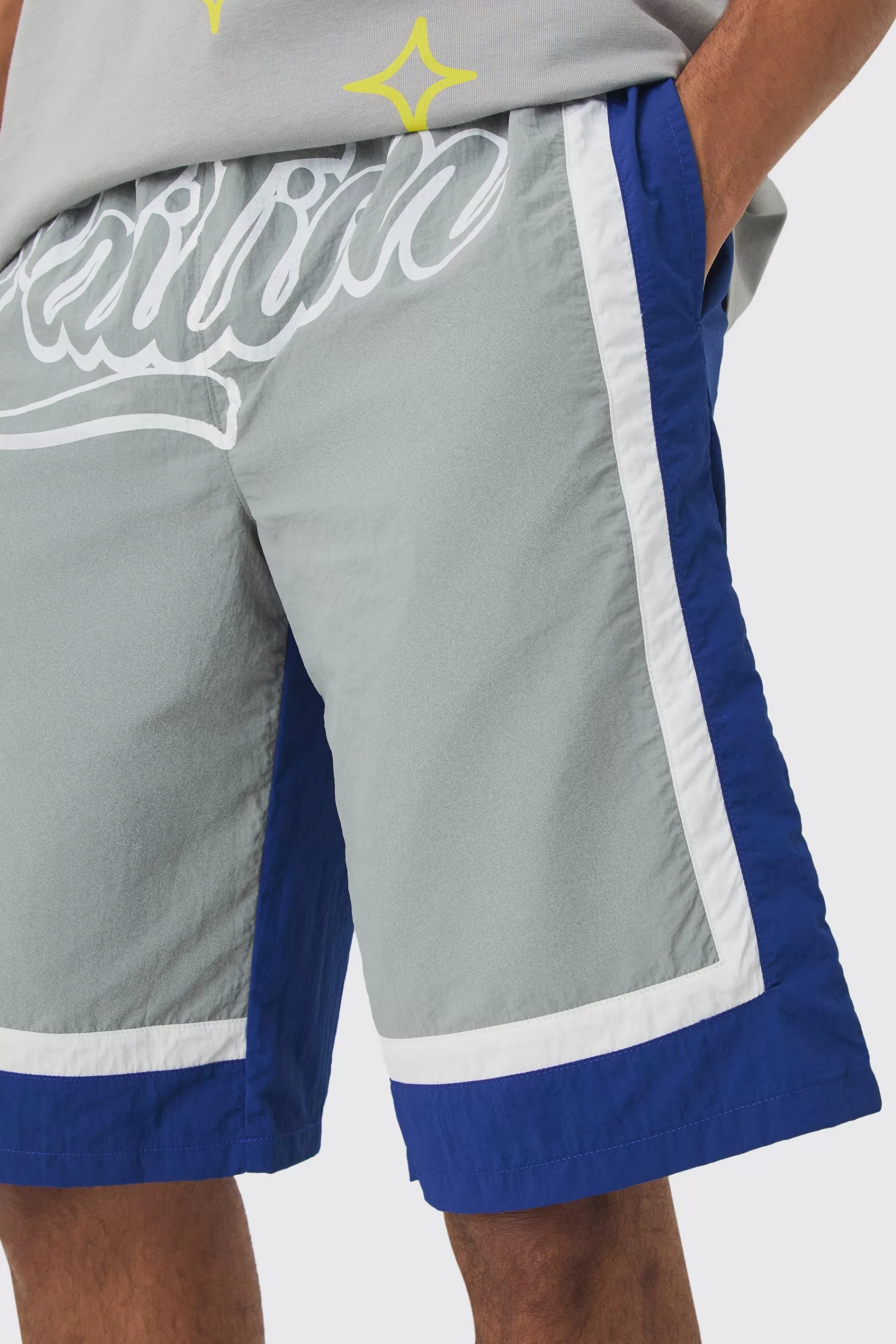 boohooMAN Elasticated Waist Limited Relaxed Longline Shell Panel Shorts | UK