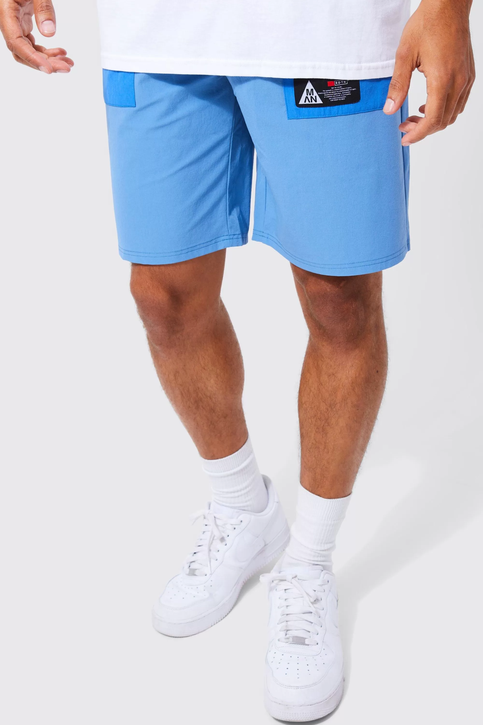 boohooMAN Elasticated Waist Relaxed Fit Branded Colour Block Cargo Shorts | UK