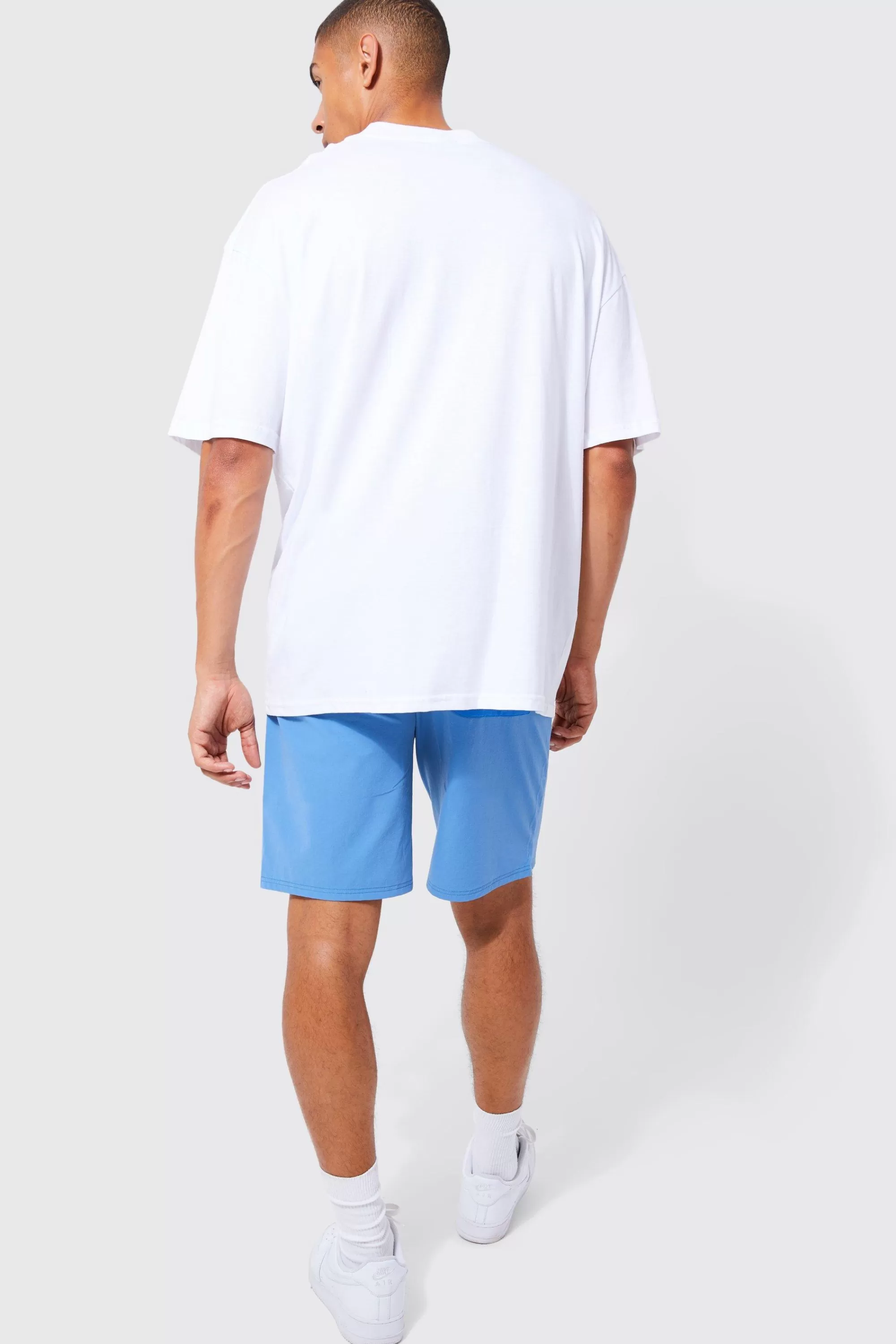 boohooMAN Elasticated Waist Relaxed Fit Branded Colour Block Cargo Shorts | UK