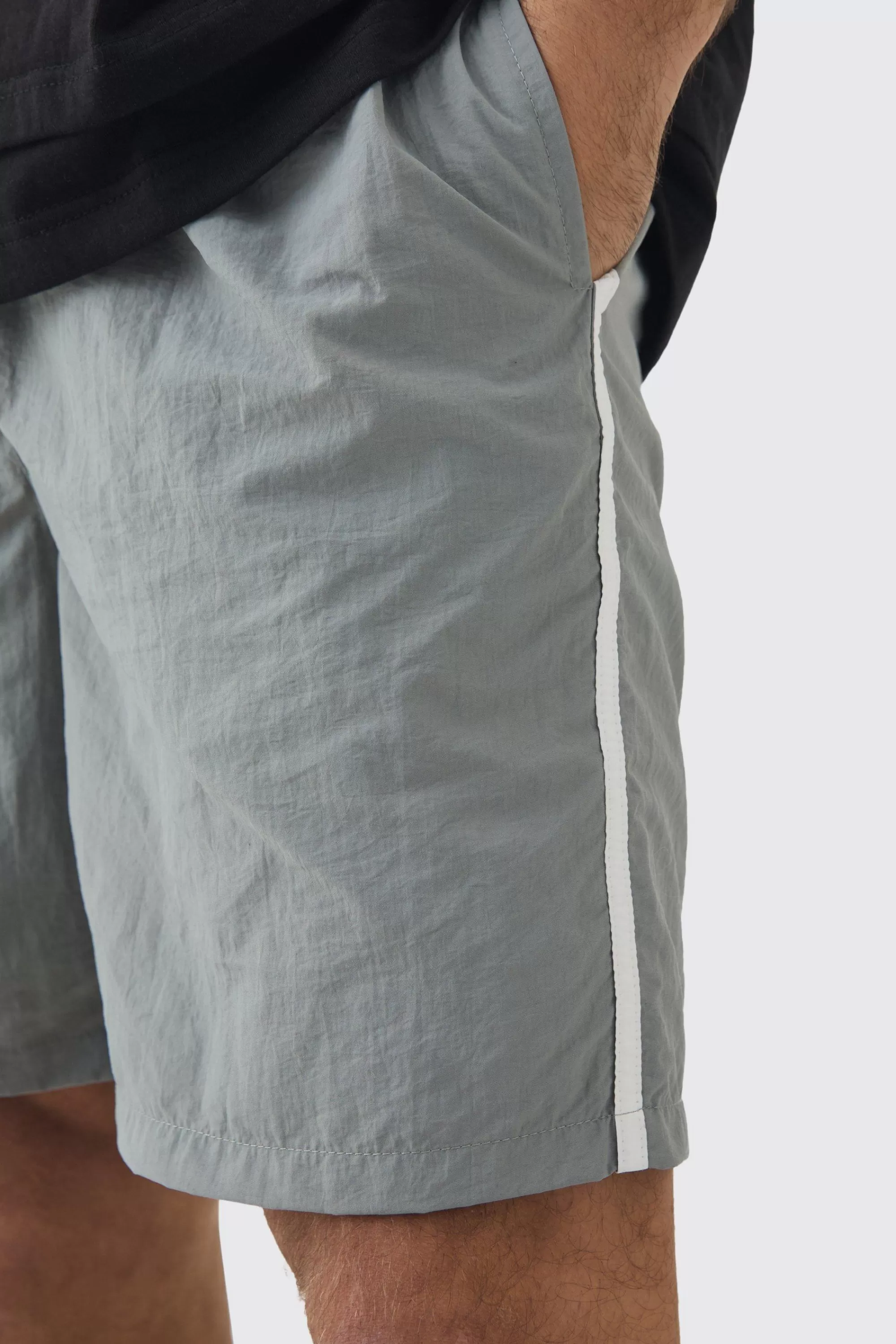 boohooMAN Elasticated Waist Relaxed Side Piping Shell Short Shorts In | UK