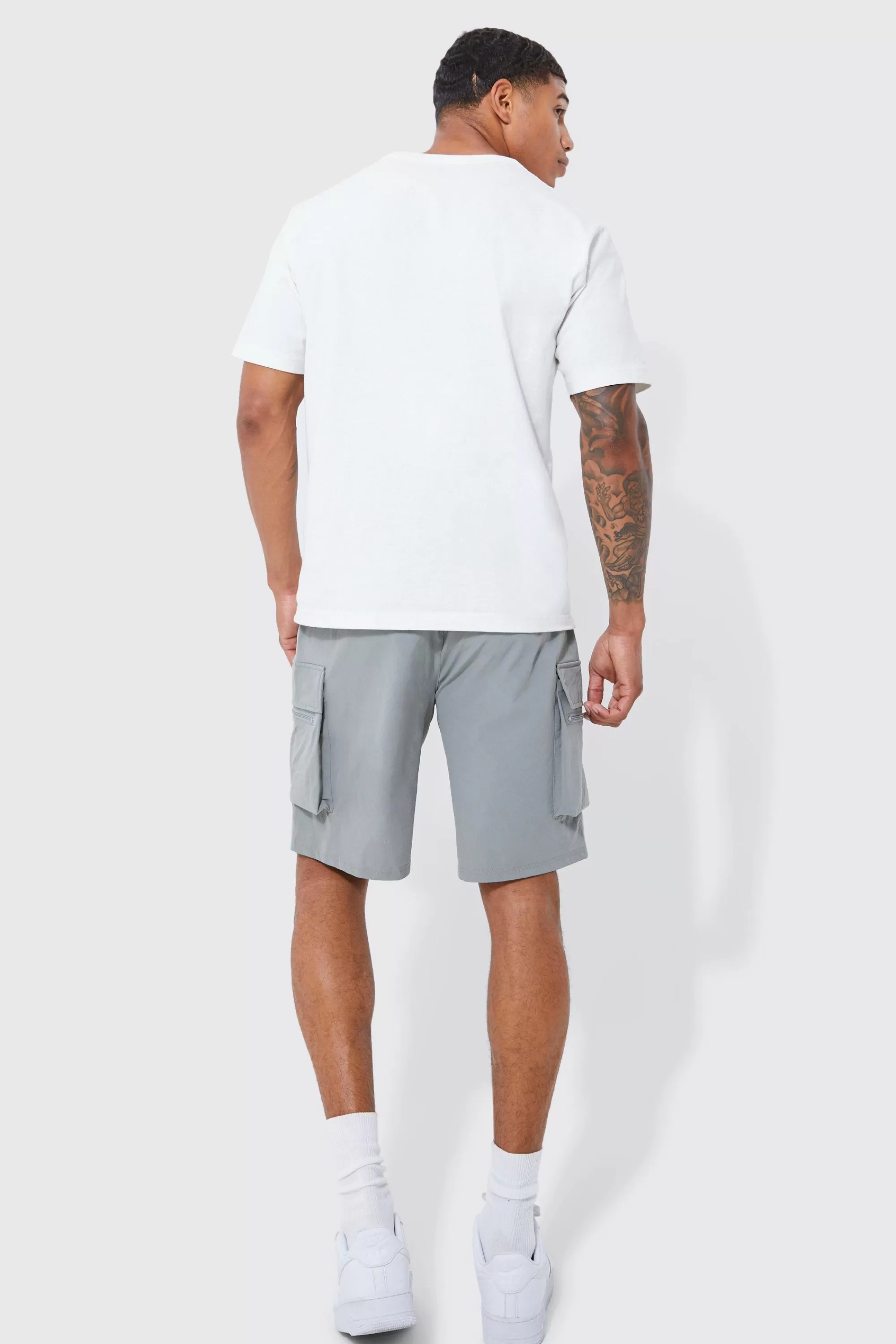 boohooMAN Elasticated Waist Relaxed Technical Stretch Cargo Short | UK