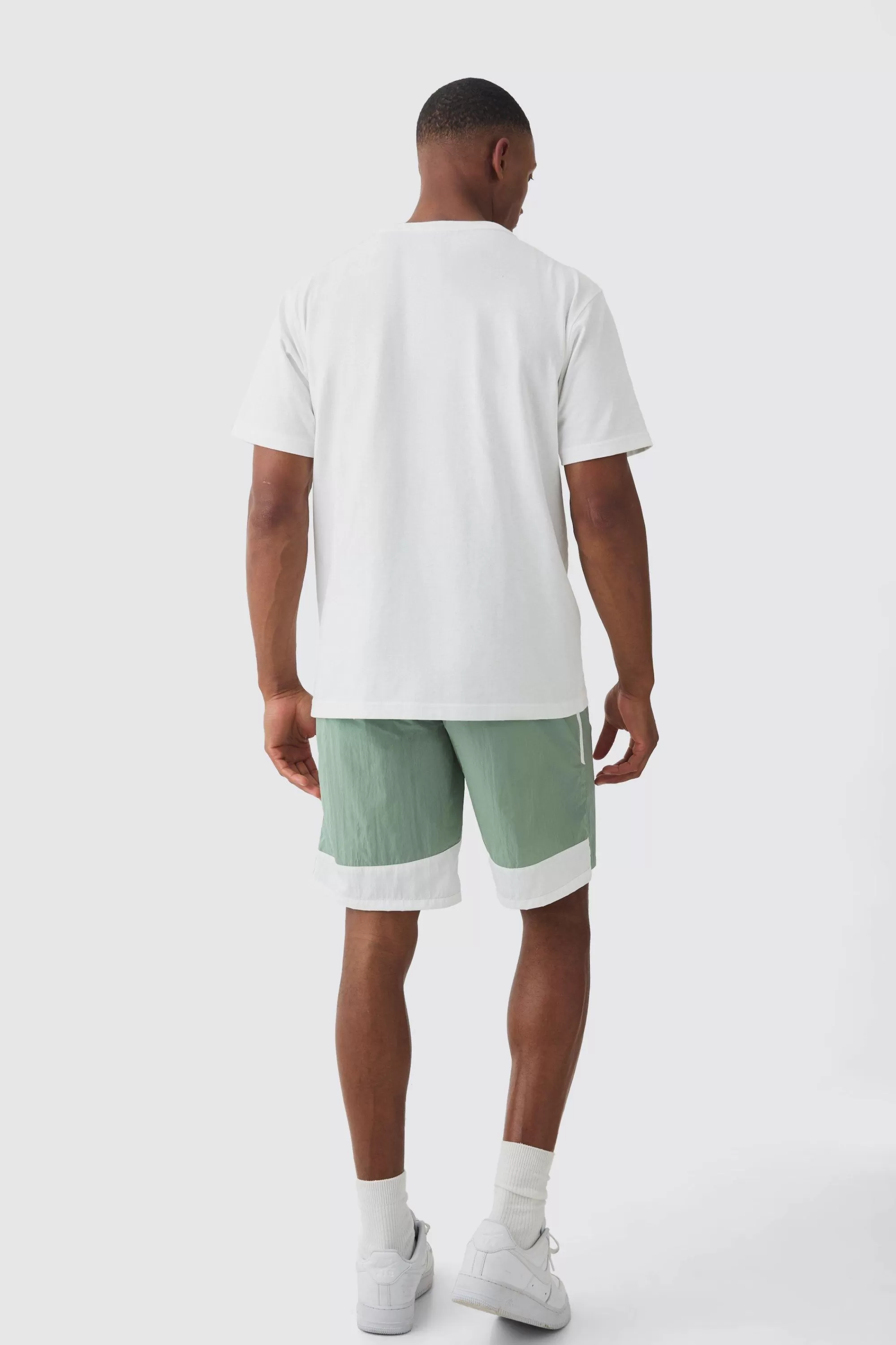 boohooMAN Elasticated Waist Side Stripe Shell Shorts In | UK