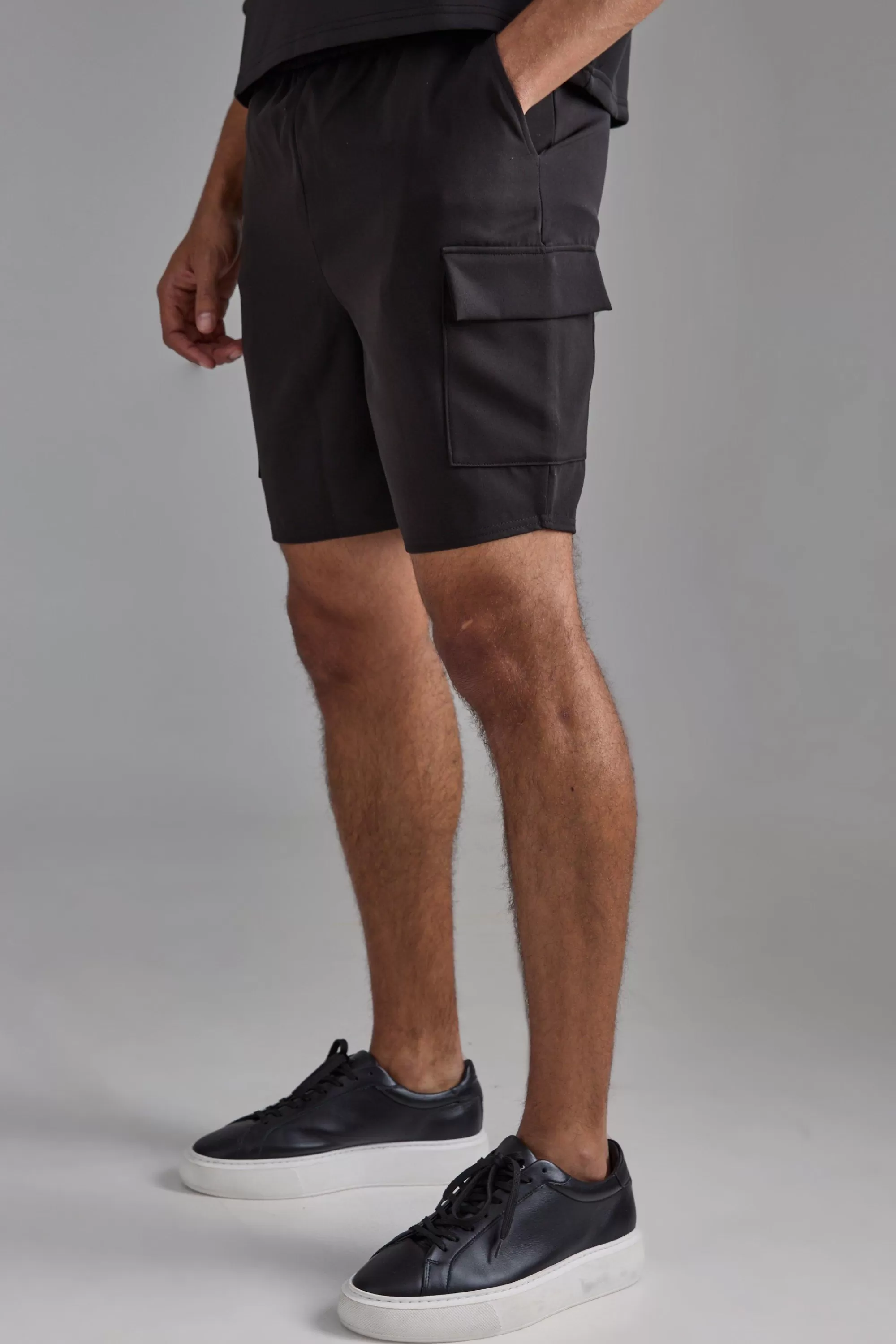 boohooMAN Elasticated Waist Skinny Fit Cargo Shorts | UK
