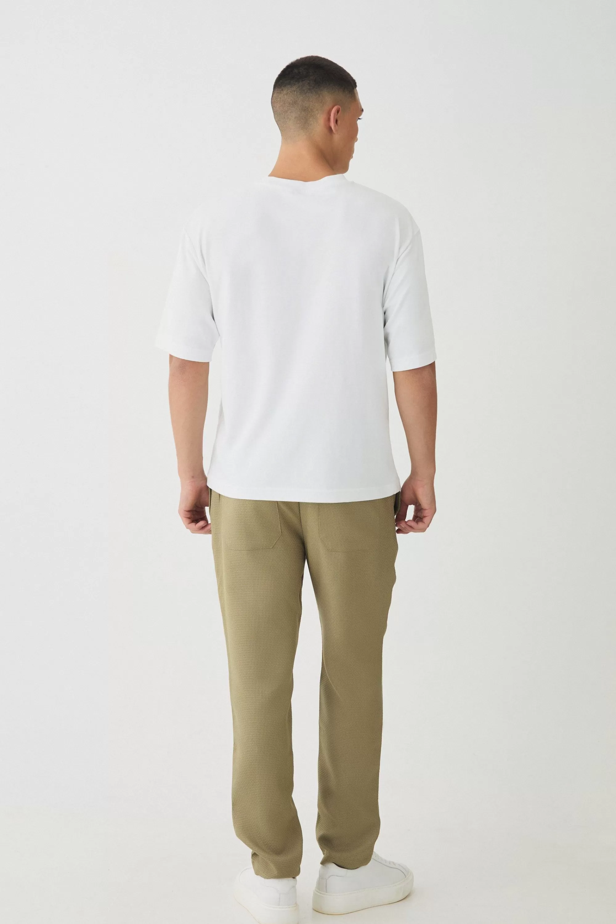 boohooMAN Elasticated Waist Tapered Pintuck Boucle Trousers | UK