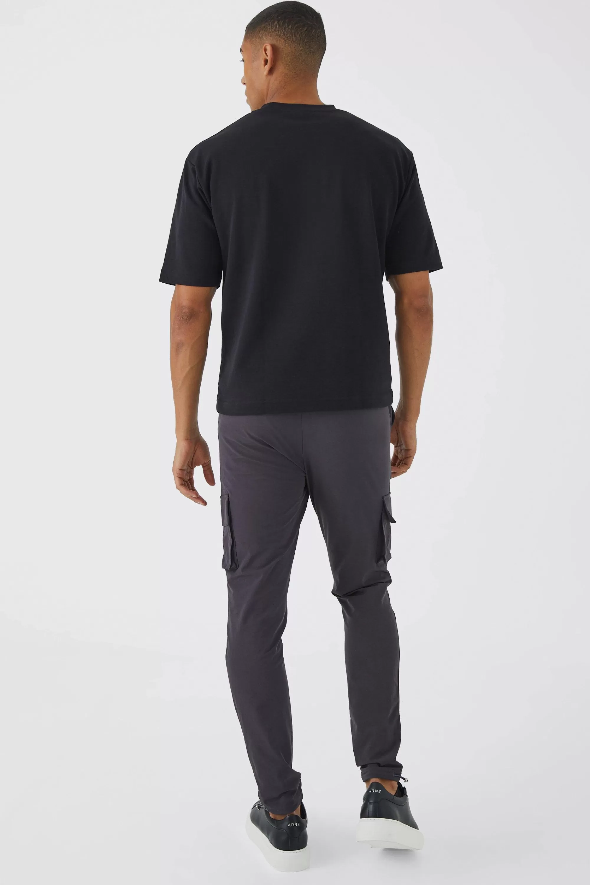 boohooMAN Elasticated Waist Technical Stretch Golf Skinny Cargo Trouser | UK