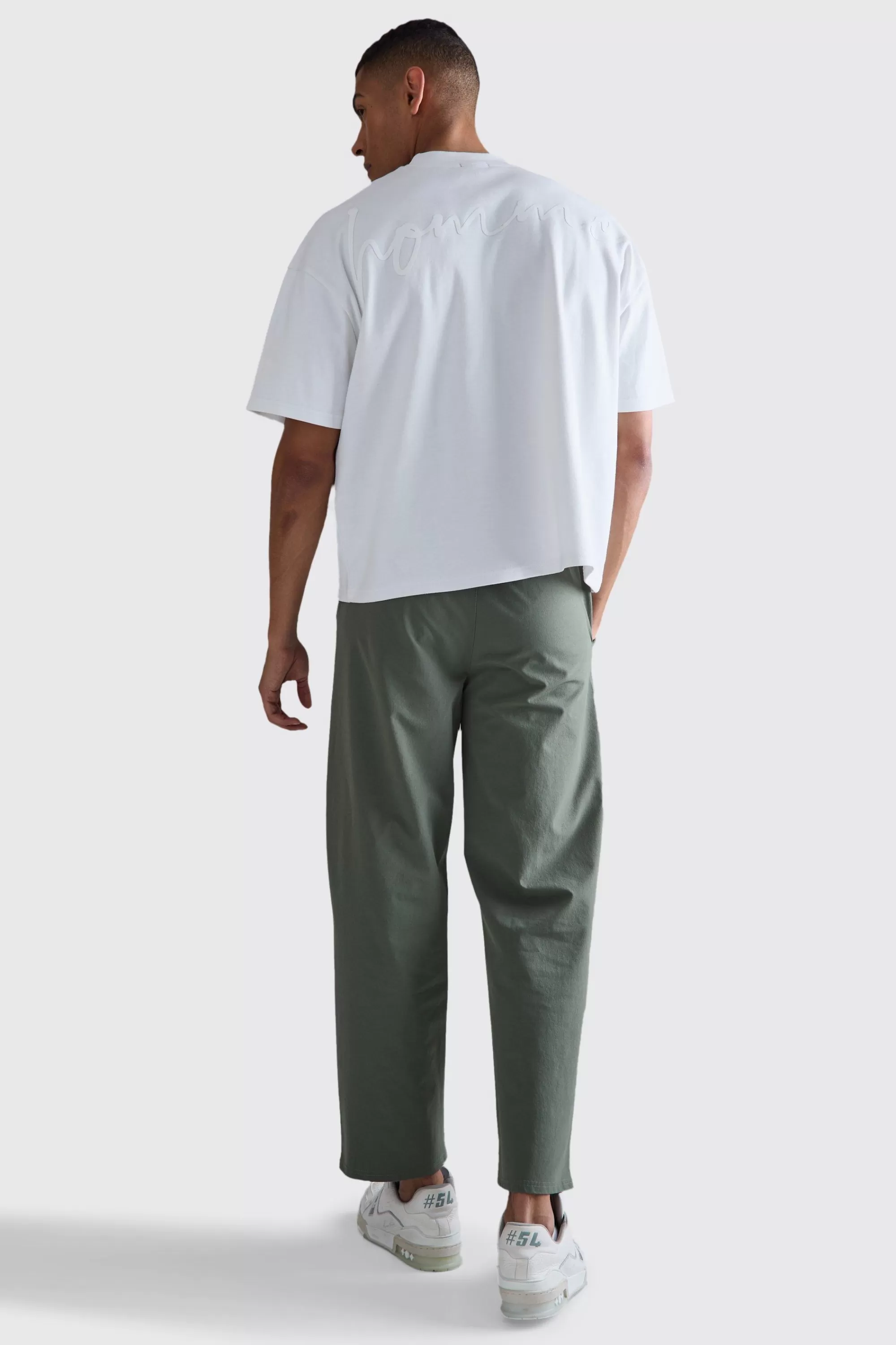boohooMAN Elasticated Waist Technical Stretch Relaxed Cropped Trouser | UK