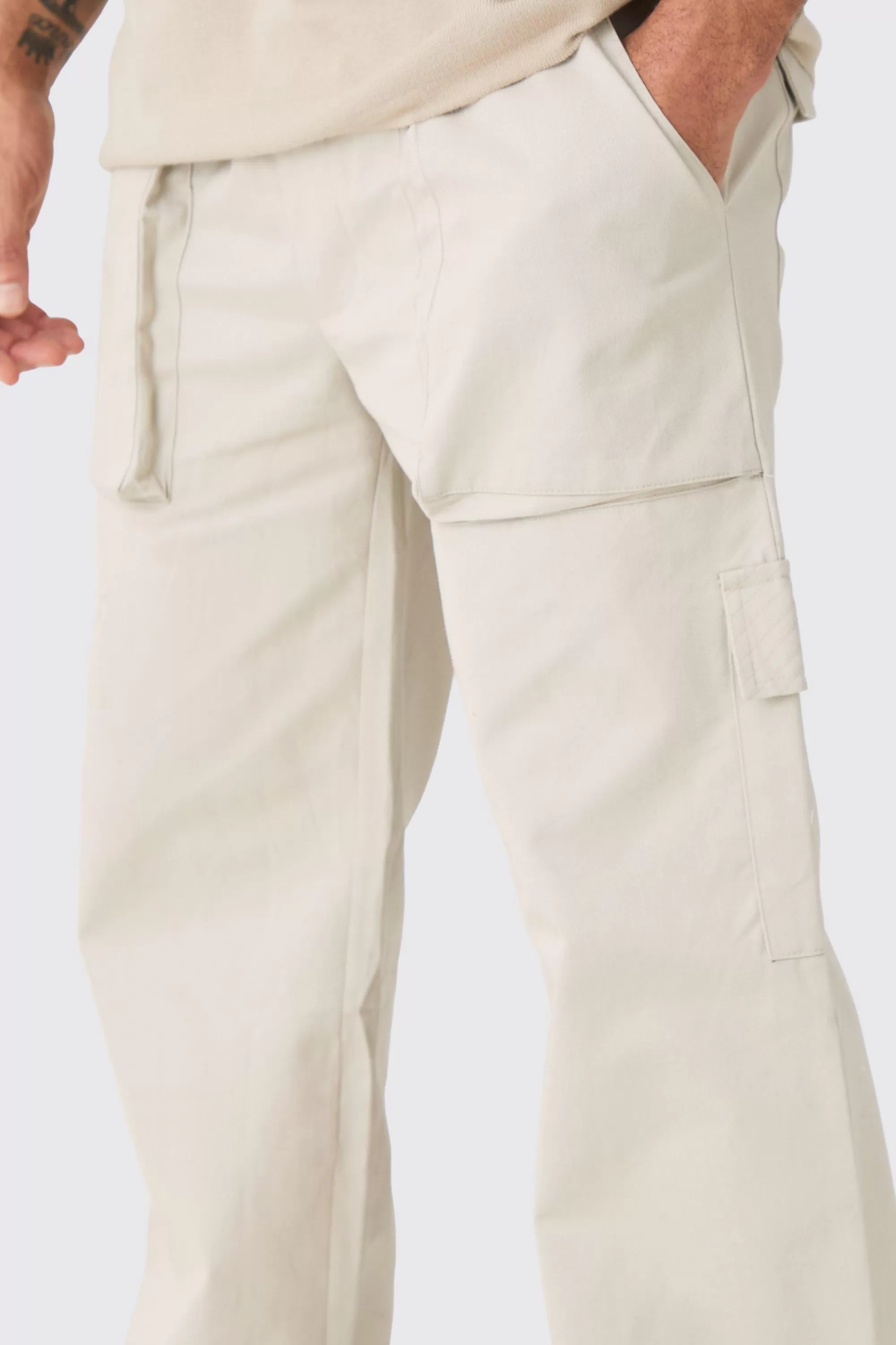 boohooMAN Elasticated Waist Zip Hem Flared Parachute Cargo Trousers | UK