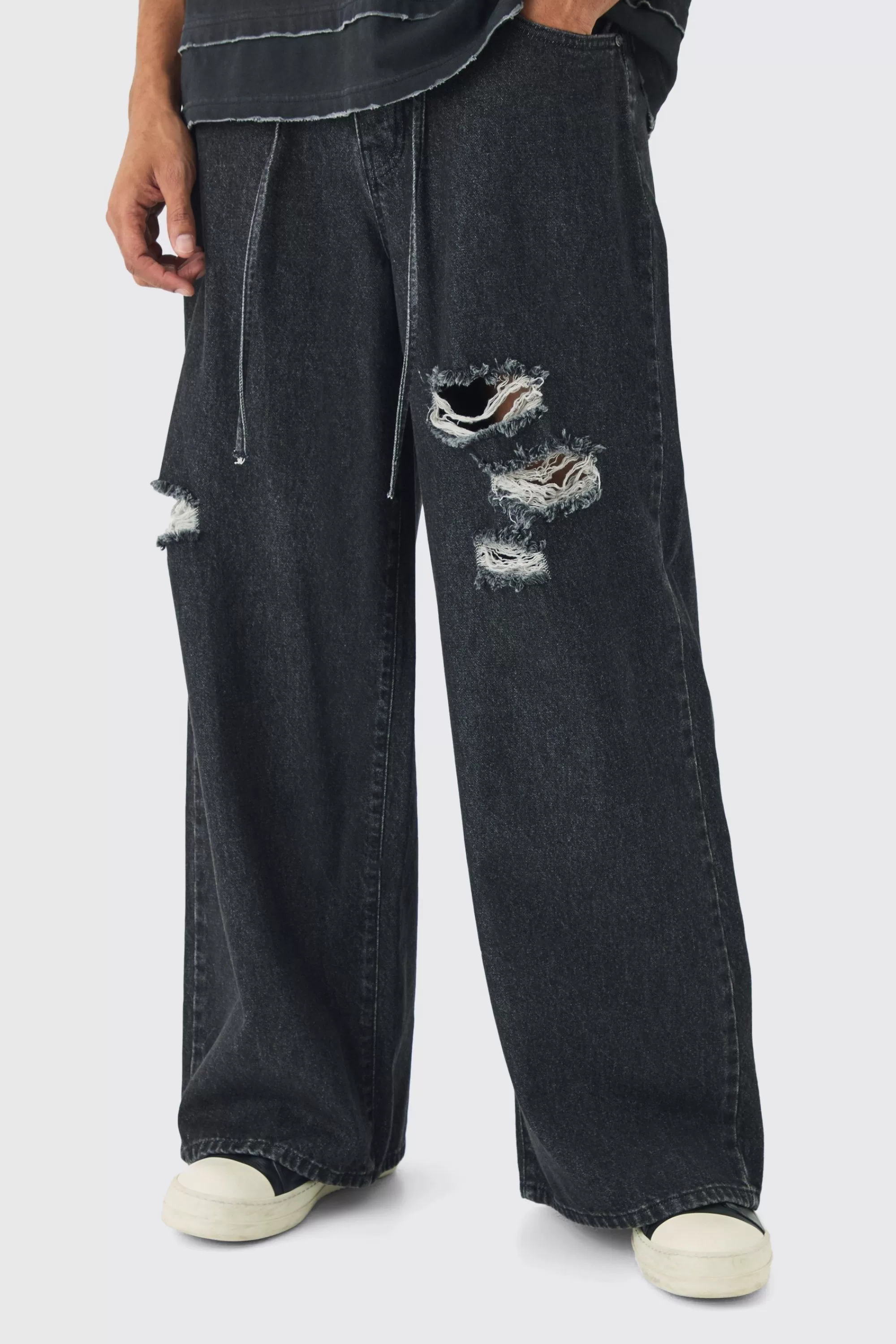 boohooMAN Extreme Baggy Rigid Ripped Jeans With Belt Detail | UK