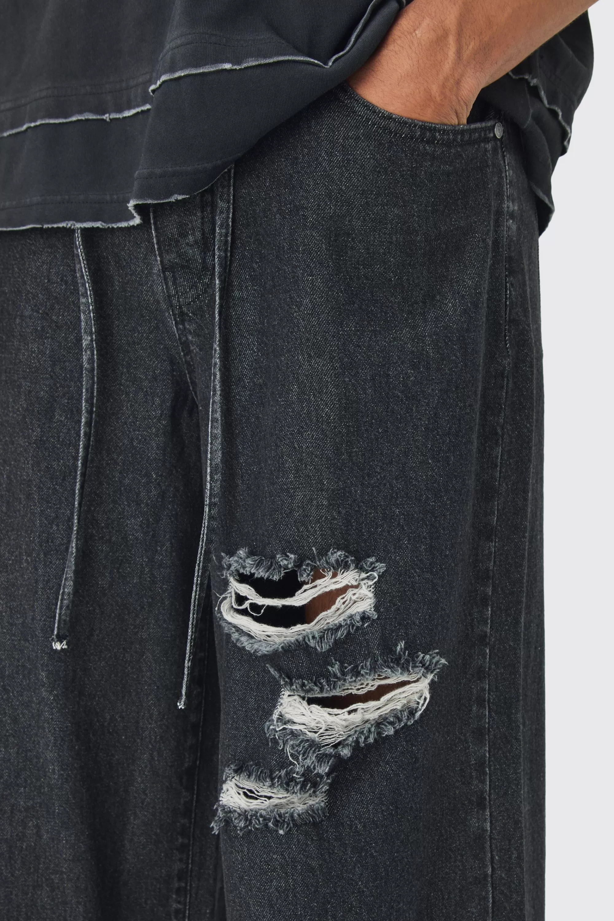boohooMAN Extreme Baggy Rigid Ripped Jeans With Belt Detail | UK