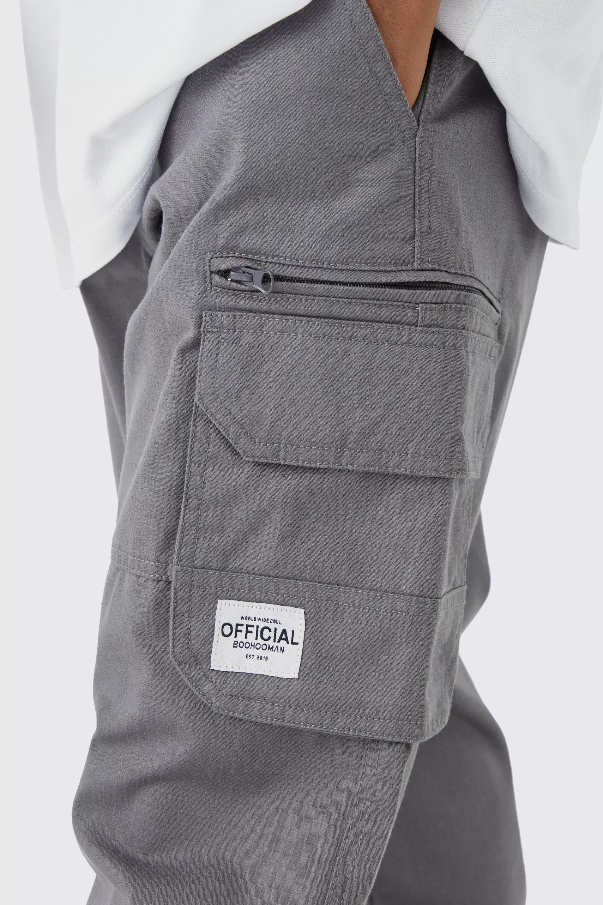 boohooMAN Fixed Ripstop Cargo Zip Trouser With Woven Tab | UK