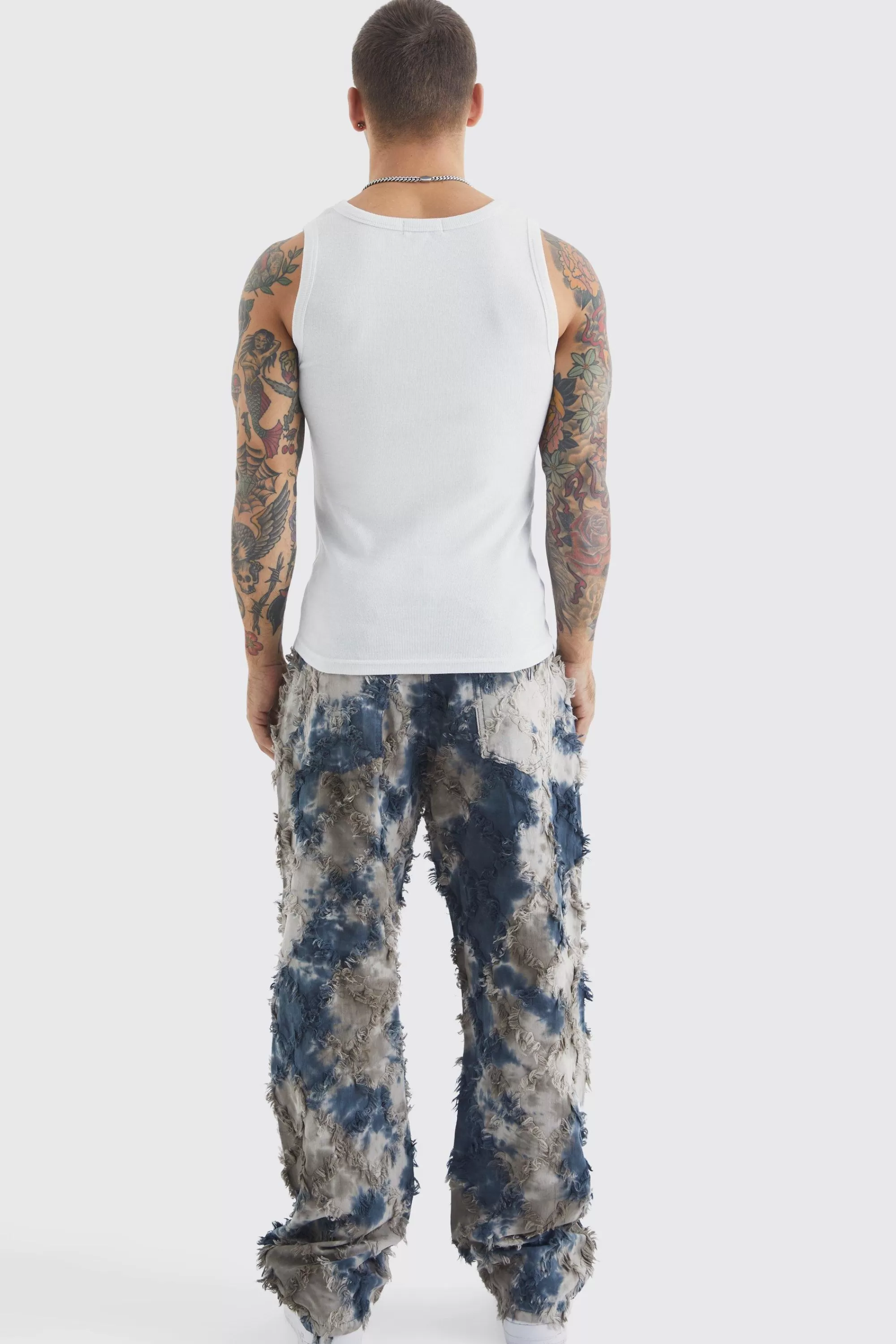 boohooMAN Fixed Waist Oil Camo Tapestry Trouser | UK