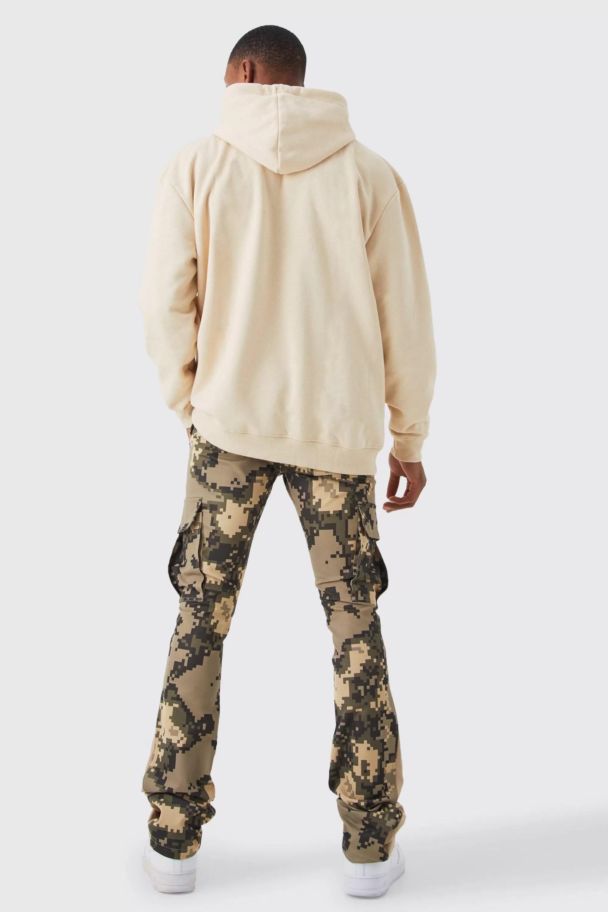 boohooMAN Fixed Waist Skinny Stacked Flare Pixel Cargo Trouser | UK