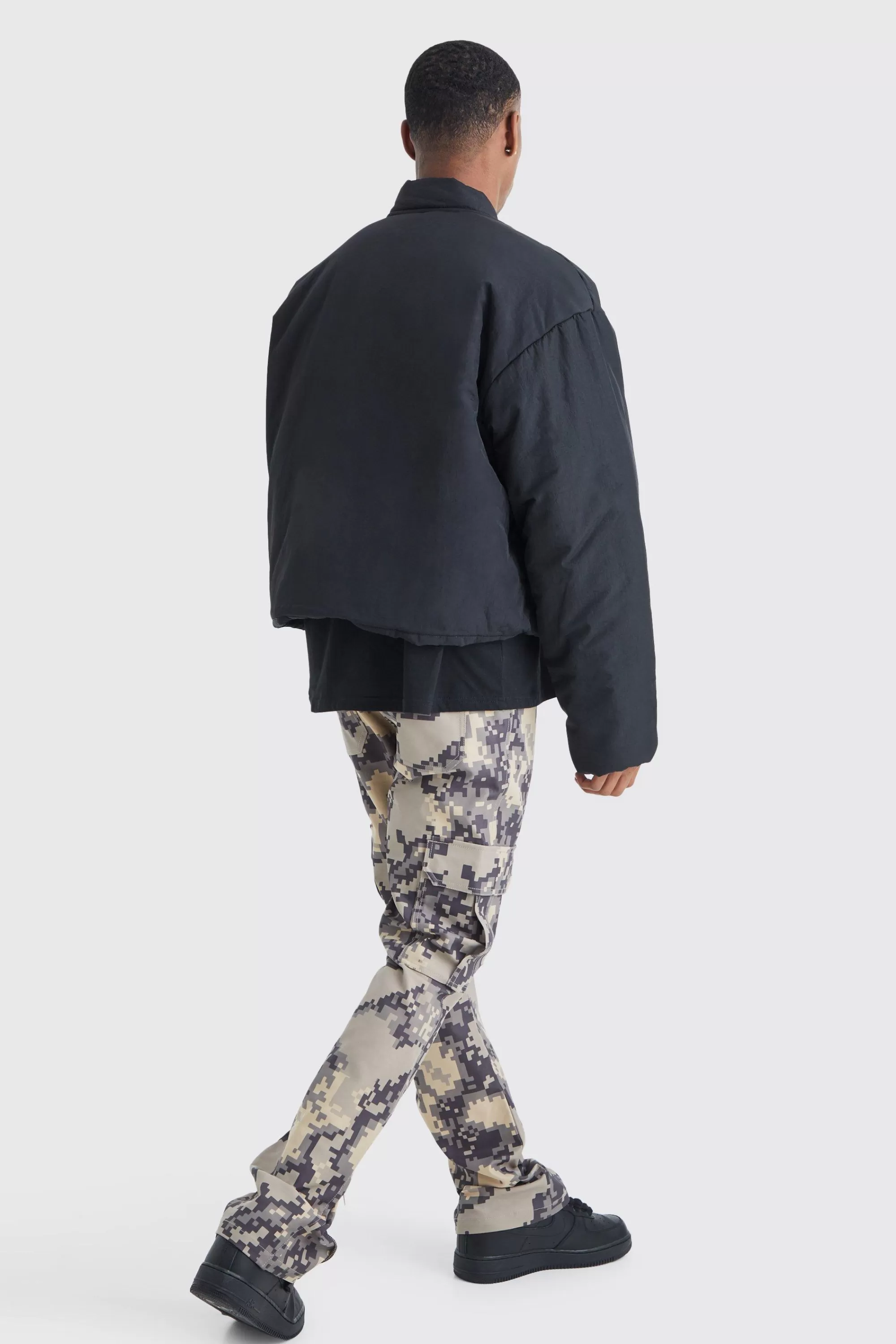 boohooMAN Fixed Waist Slim Flare Gusset Pixel Camo Cargo Trouser | UK