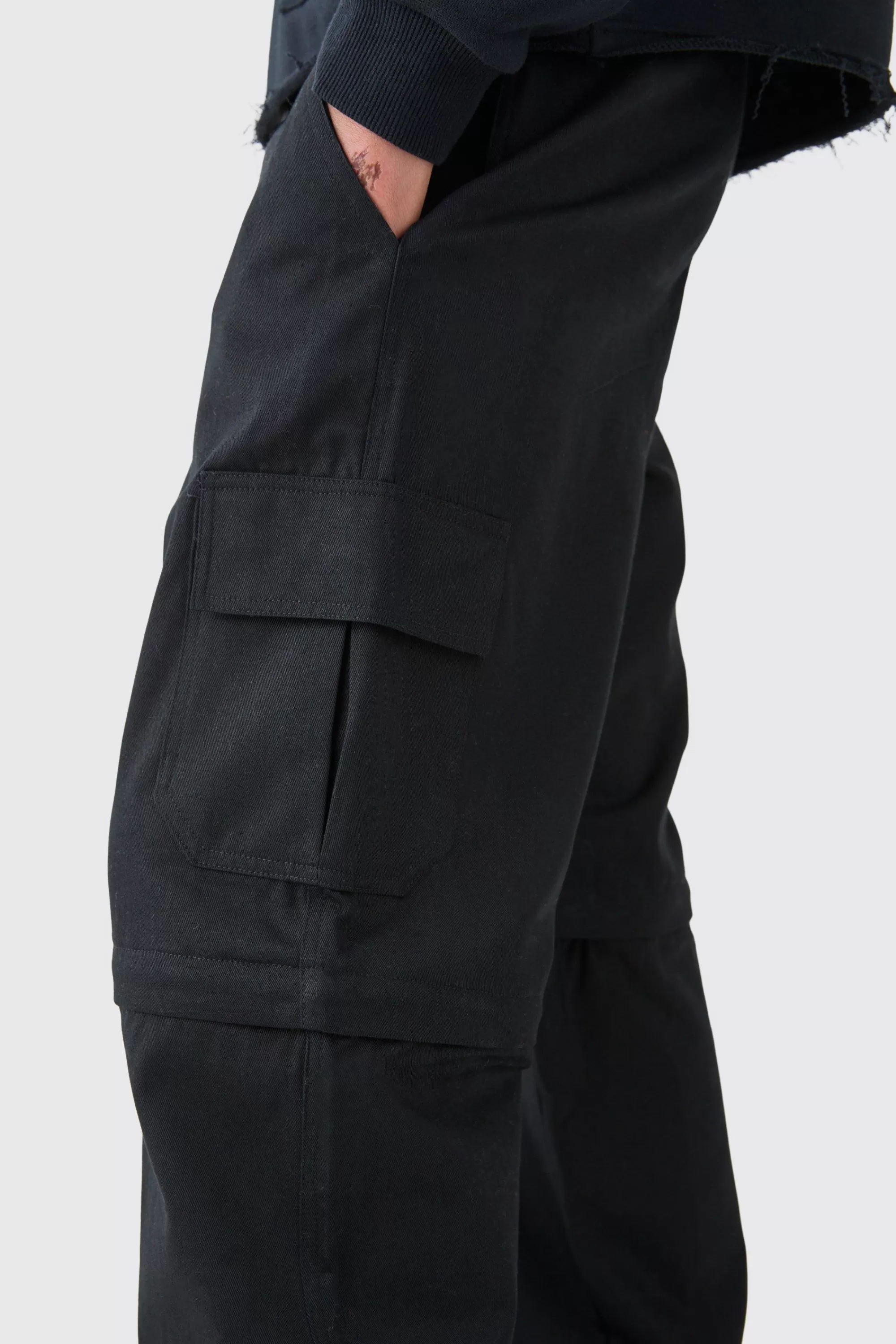boohooMAN Fixed Waist Twill Popper Hem Zip Off Relaxed Cargo Trousers | UK