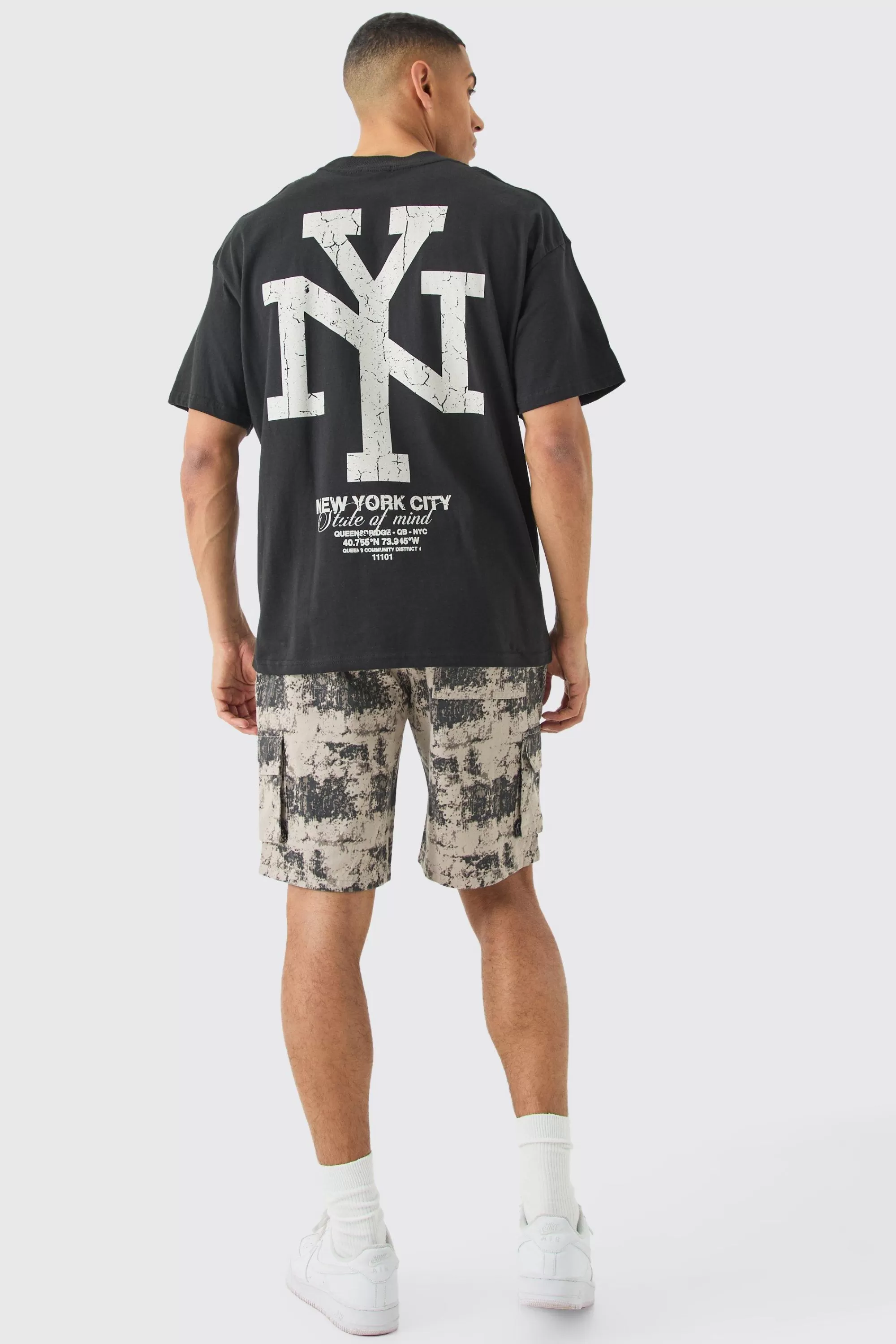 boohooMAN Fixed Waist Woven Tab Blurred Camo Relaxed Cargo Shorts | UK