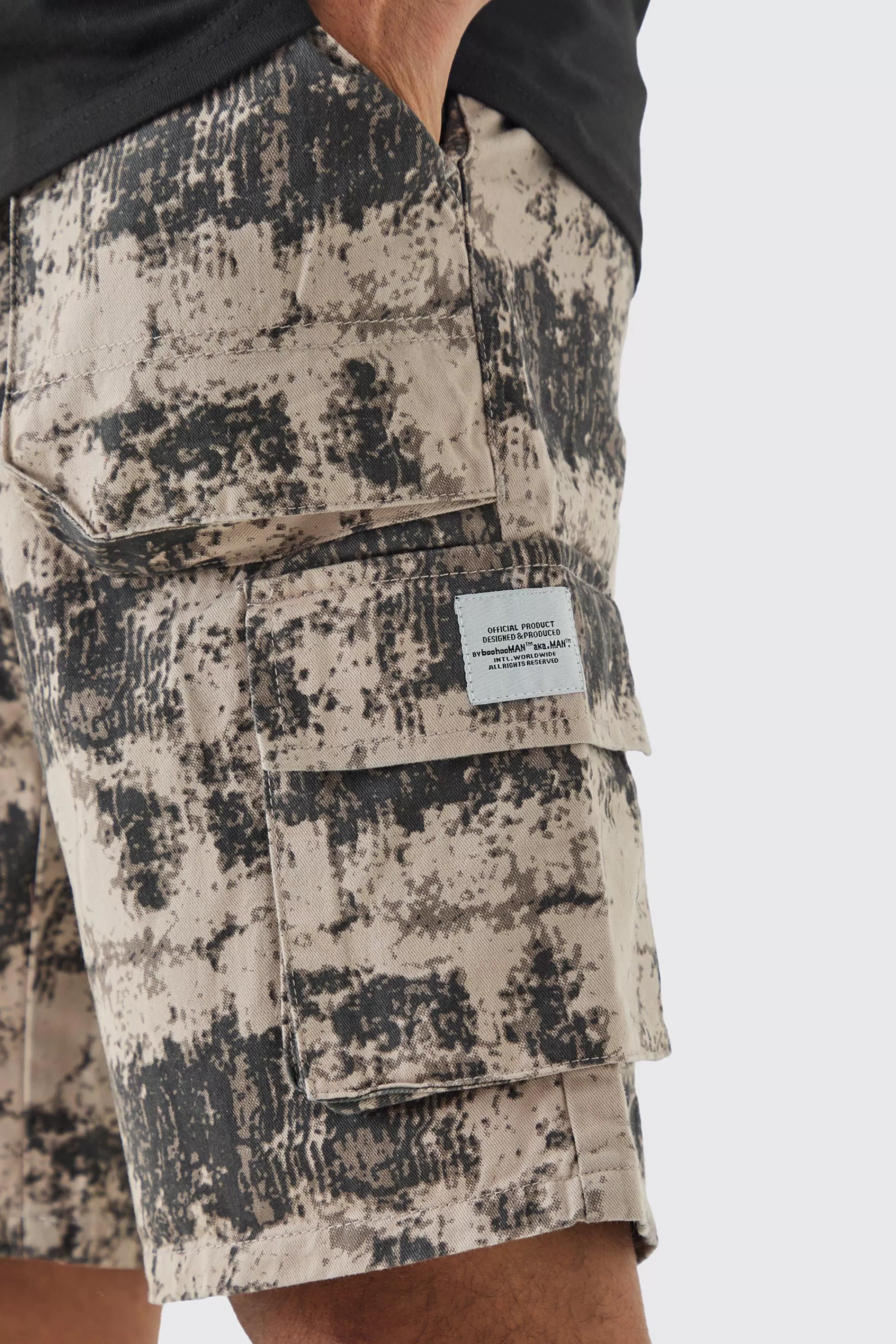 boohooMAN Fixed Waist Woven Tab Blurred Camo Relaxed Cargo Shorts | UK