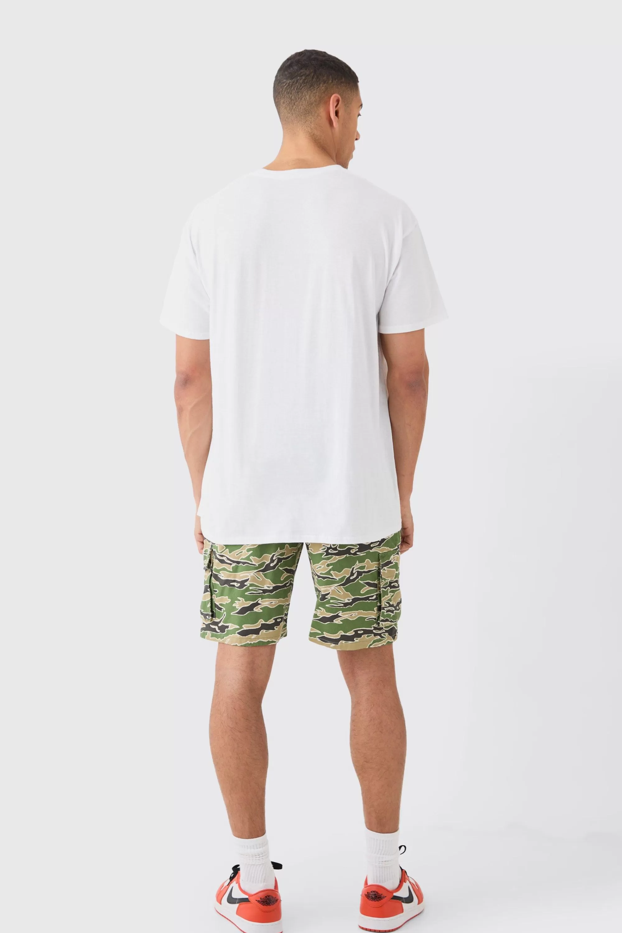 boohooMAN Fixed Waist Woven Tab Camo Relaxed Cargo Shorts | UK