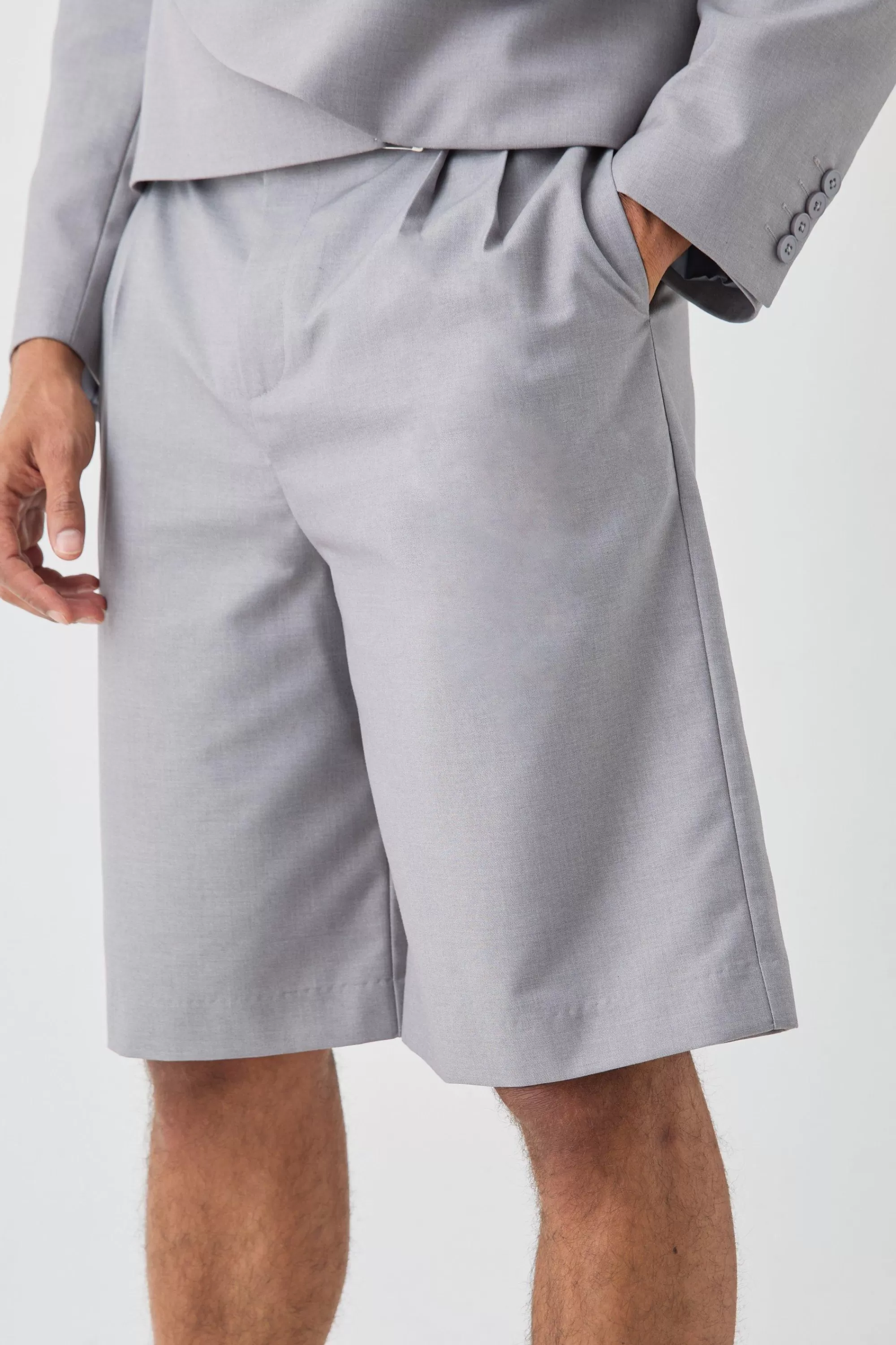 boohooMAN Fixed Waistband Tailored Pleated Jorts In | UK