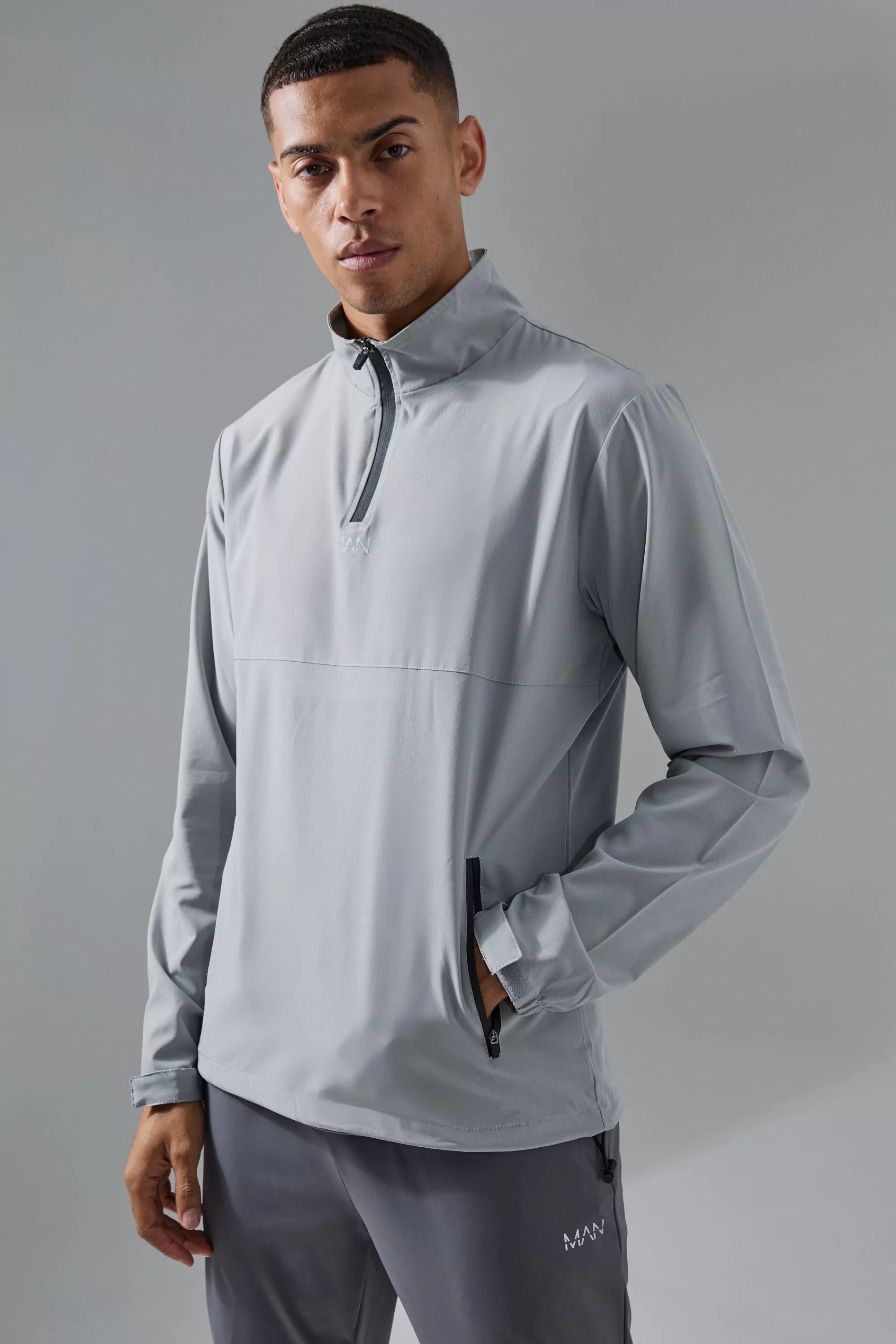 boohooMAN Man Active Shower Resist 1/4 Zip Funnel Neck Windbreaker | UK