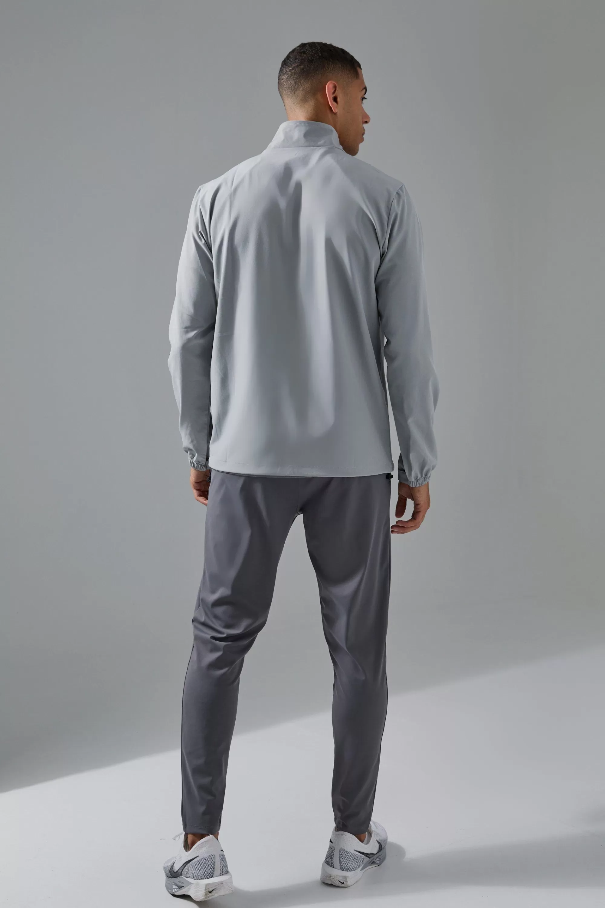 boohooMAN Man Active Shower Resist 1/4 Zip Funnel Neck Windbreaker | UK