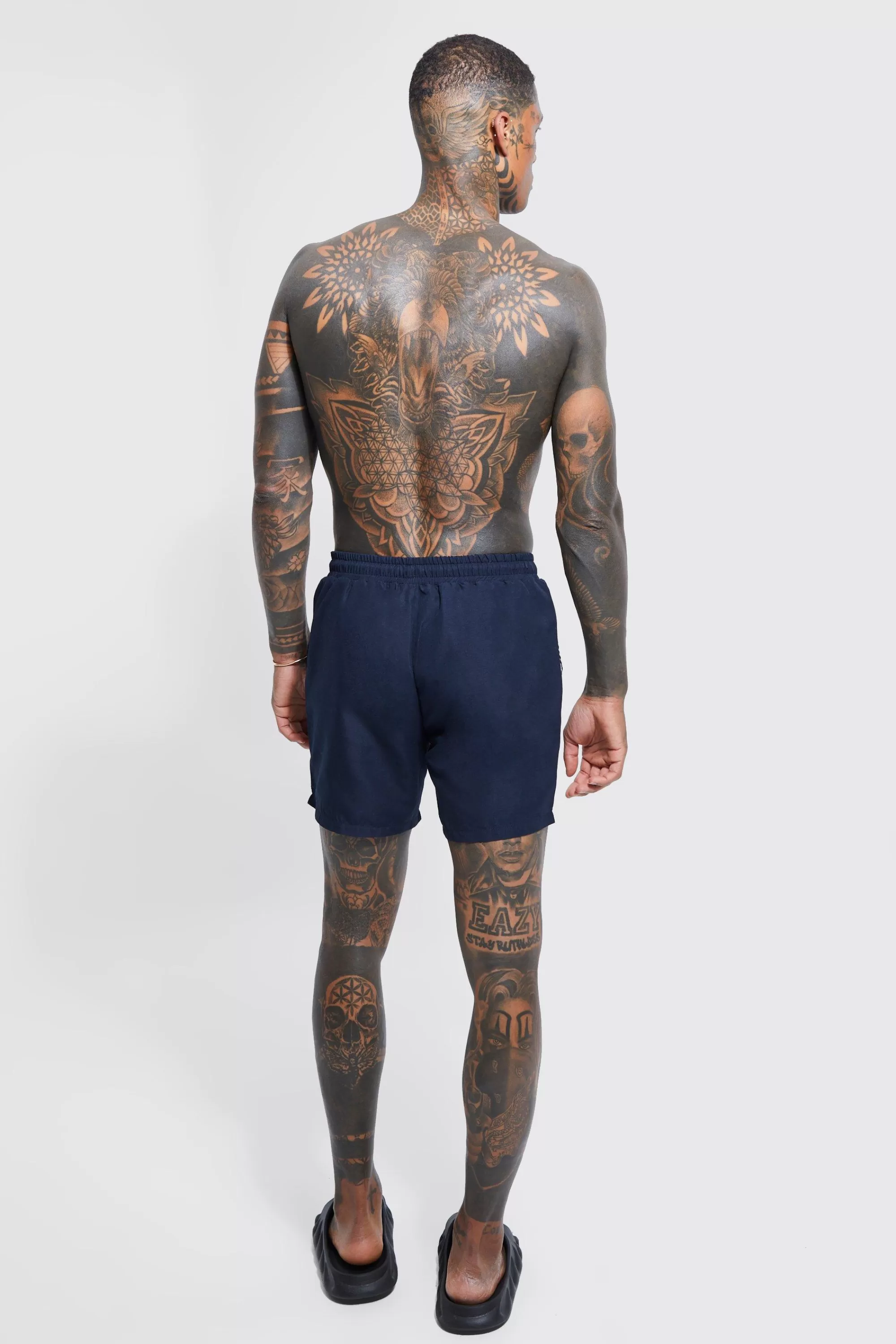 boohooMAN Man Signature Mid Length Swim Shorts | UK