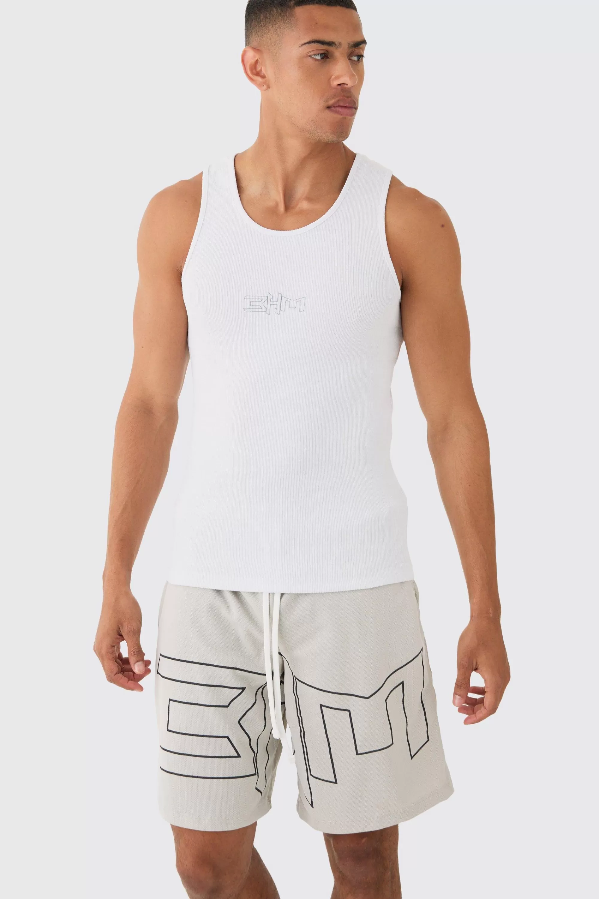 boohooMAN Muscle Fit Ribbed Vest & Mesh Basketball Shorts Set | UK