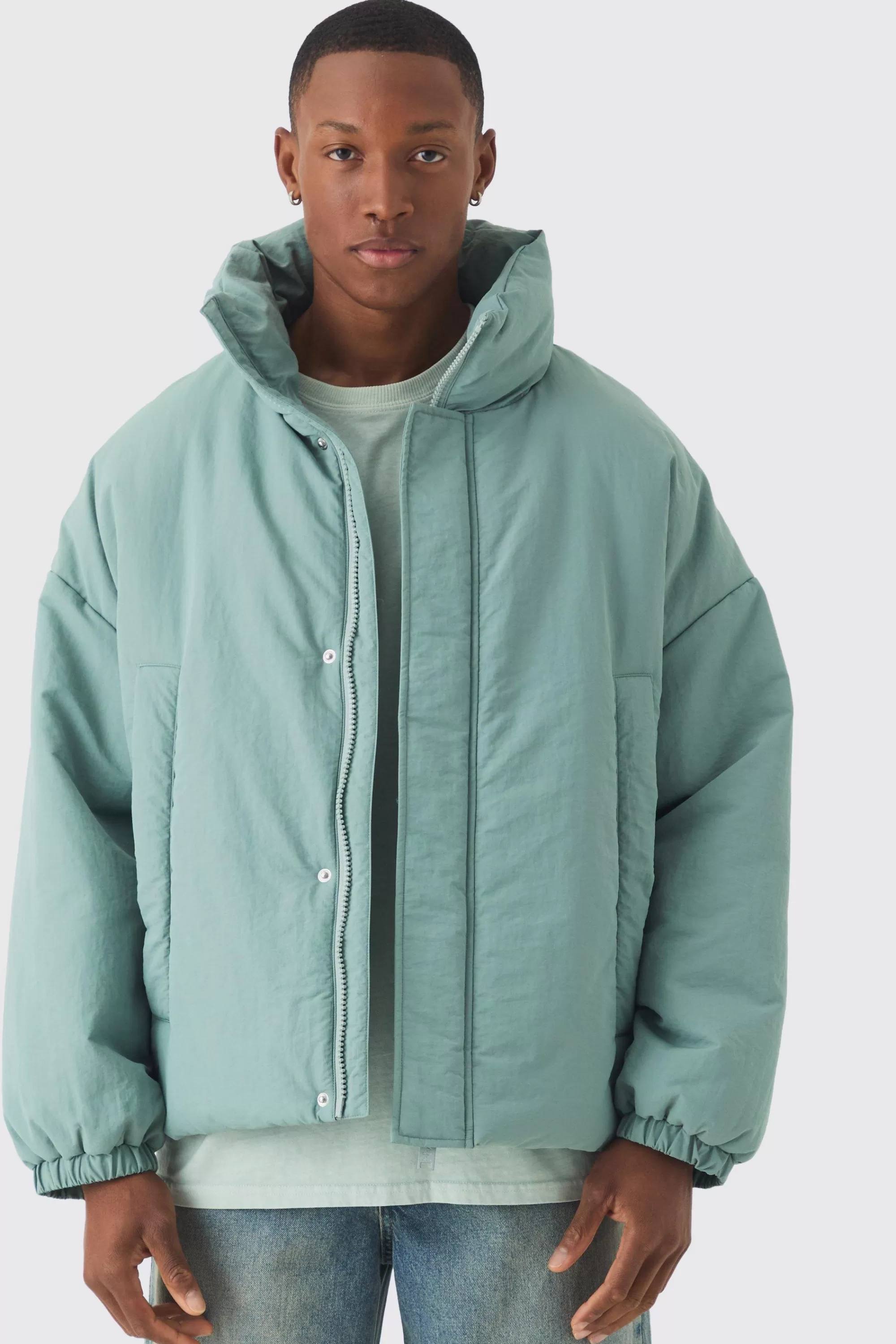 boohooMAN Oversized Boxy Padded Funnel Neck Coat In | UK