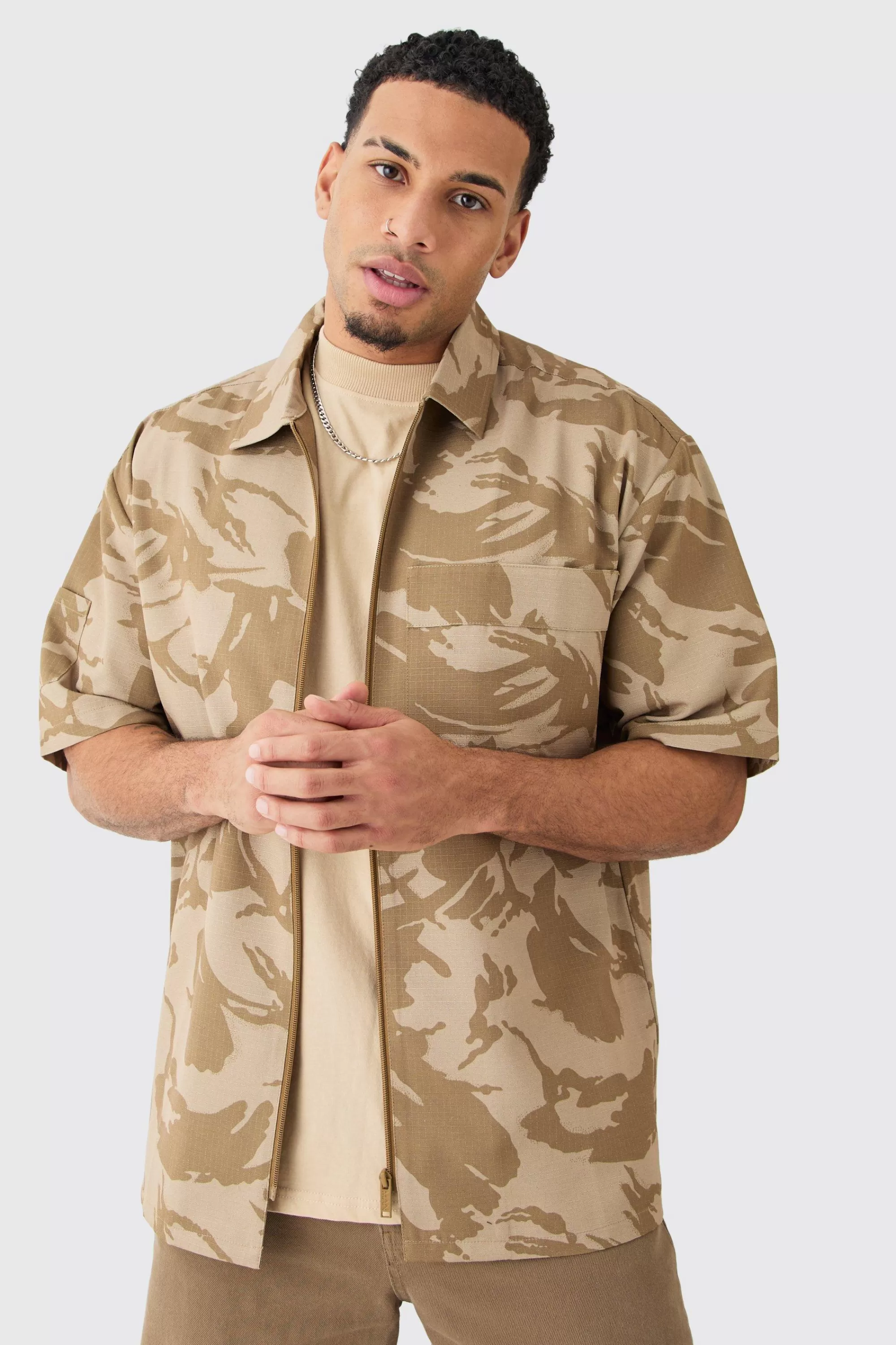 boohooMAN Oversized Boxy Ripstop Zip Through Camo Shirt | UK