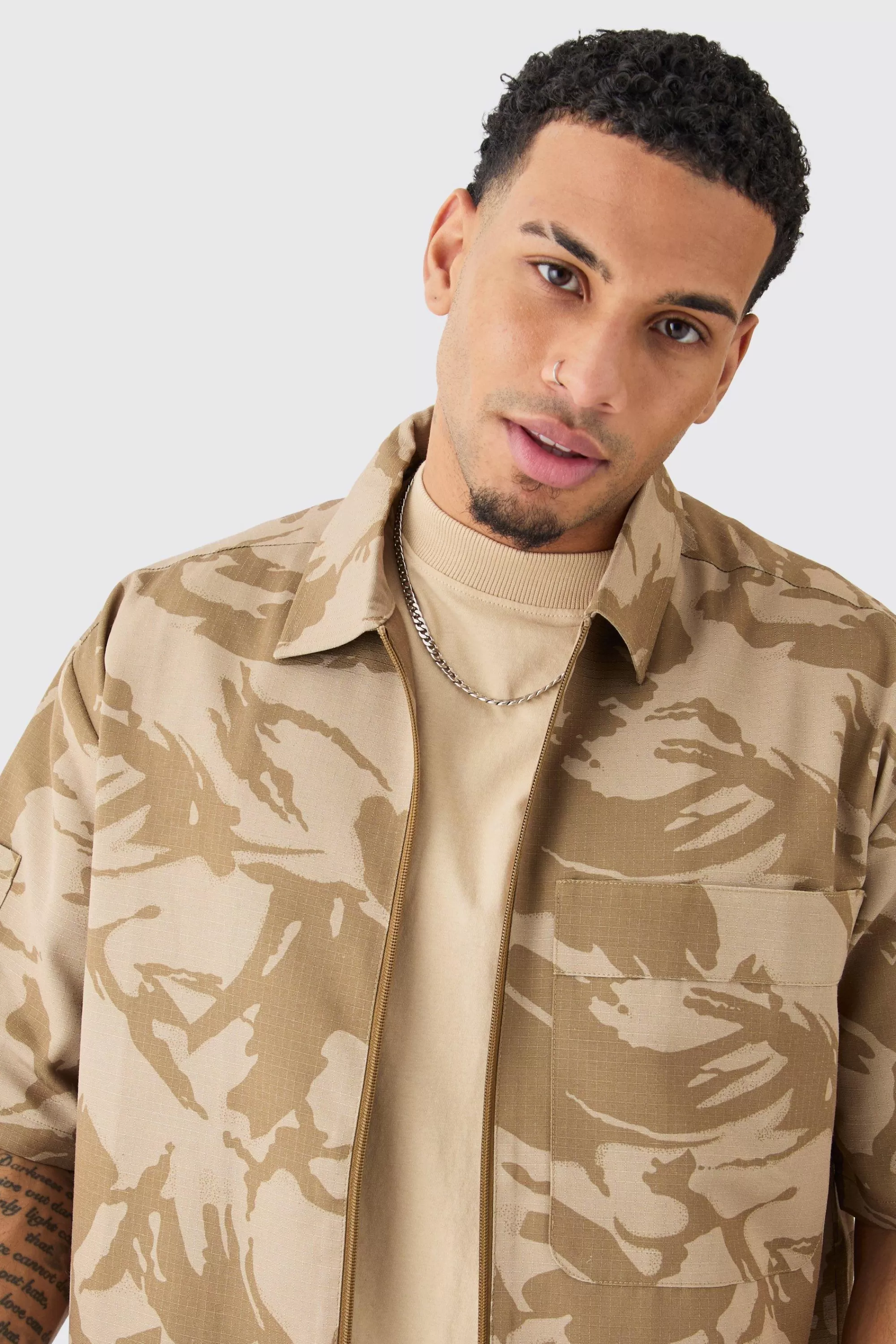 boohooMAN Oversized Boxy Ripstop Zip Through Camo Shirt | UK