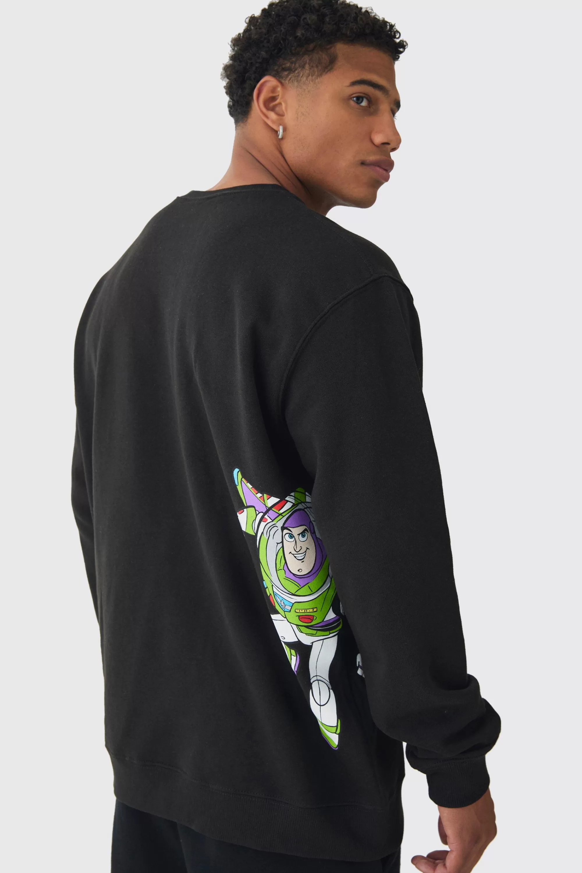boohooMAN Oversized Buzz Lightyear Toy Story License Print Sweatshirt | UK