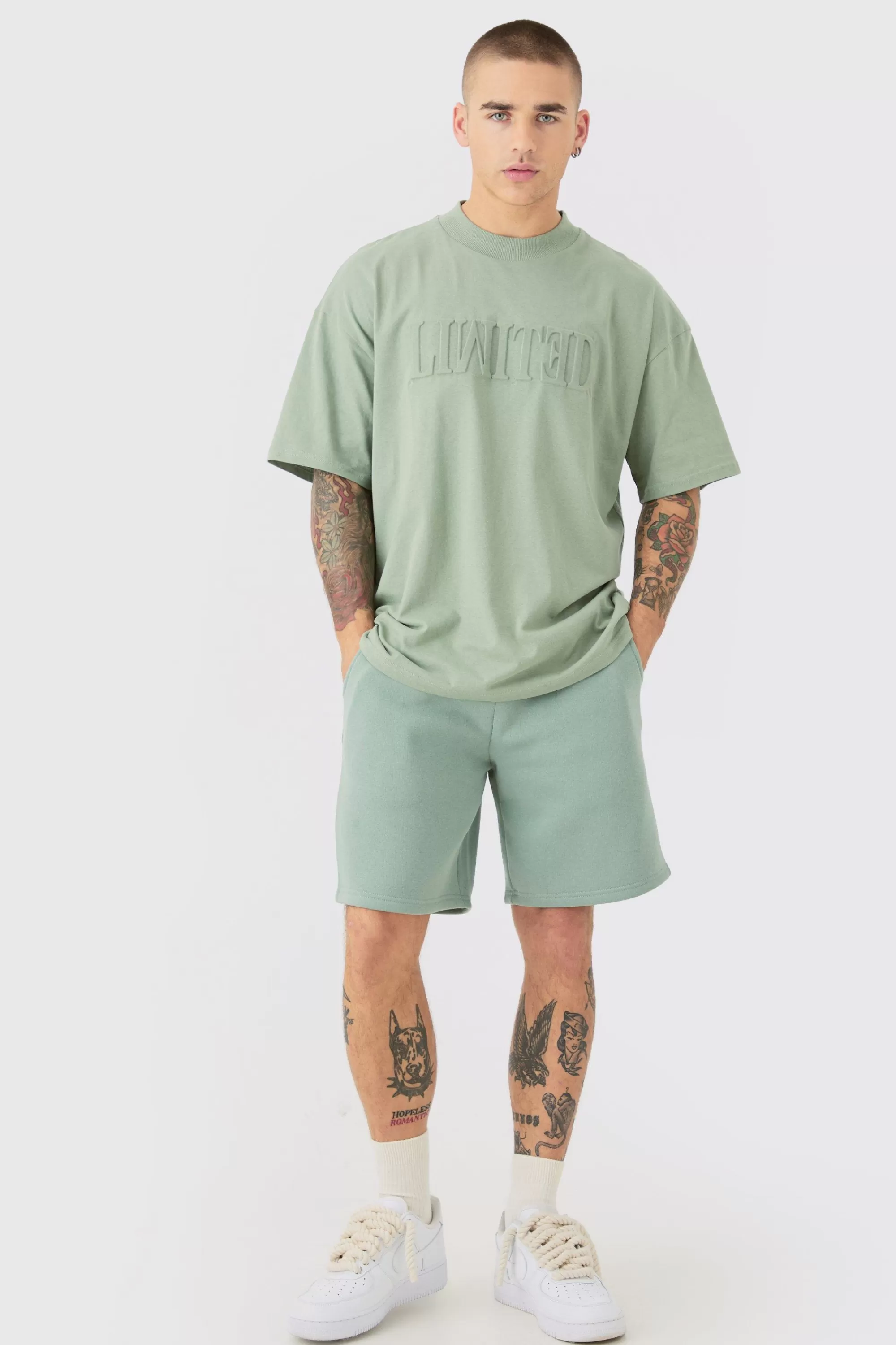boohooMAN Oversized Extended Neck Limited Embossed T-shirt And Relaxed Short Set | UK