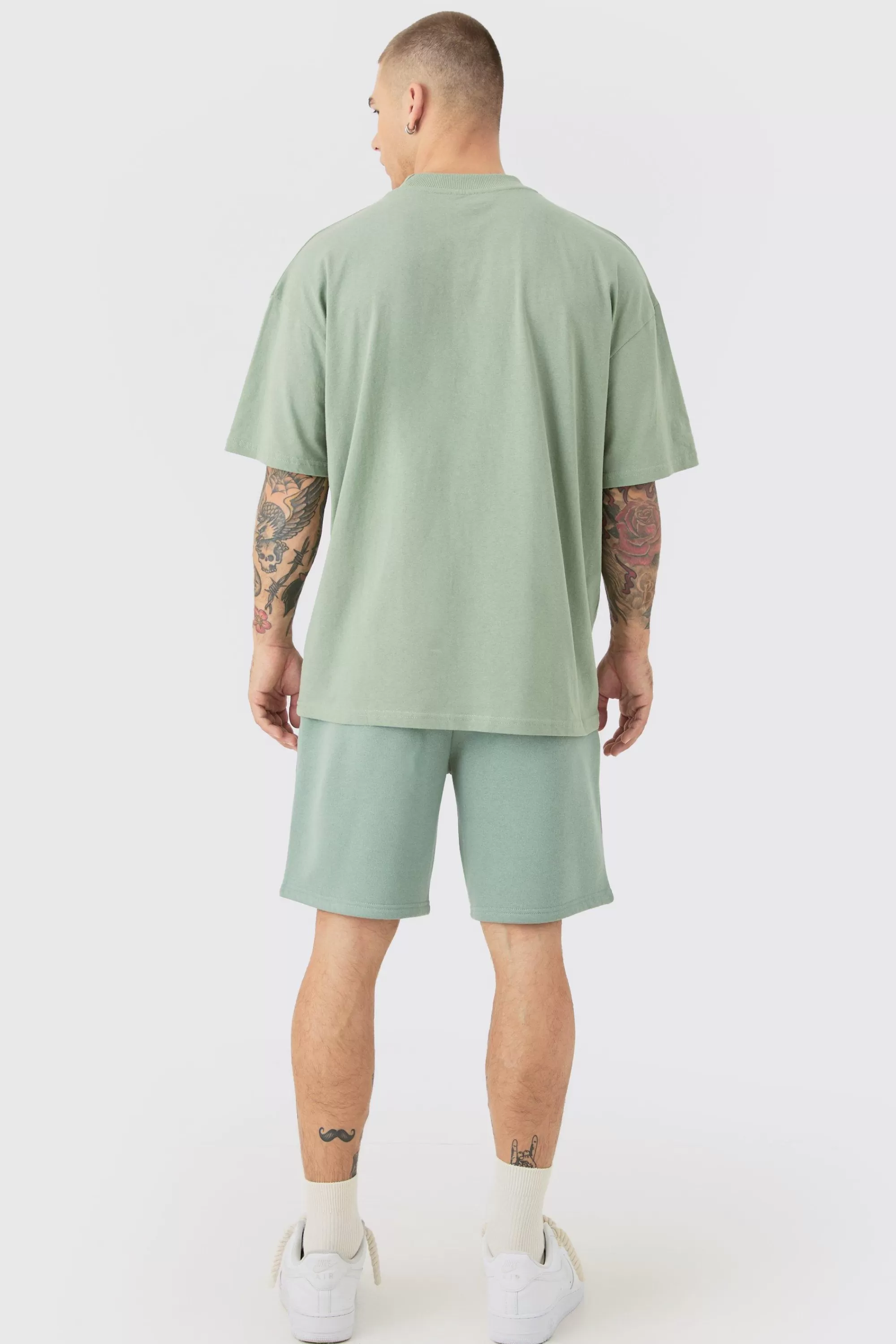 boohooMAN Oversized Extended Neck Limited Embossed T-shirt And Relaxed Short Set | UK