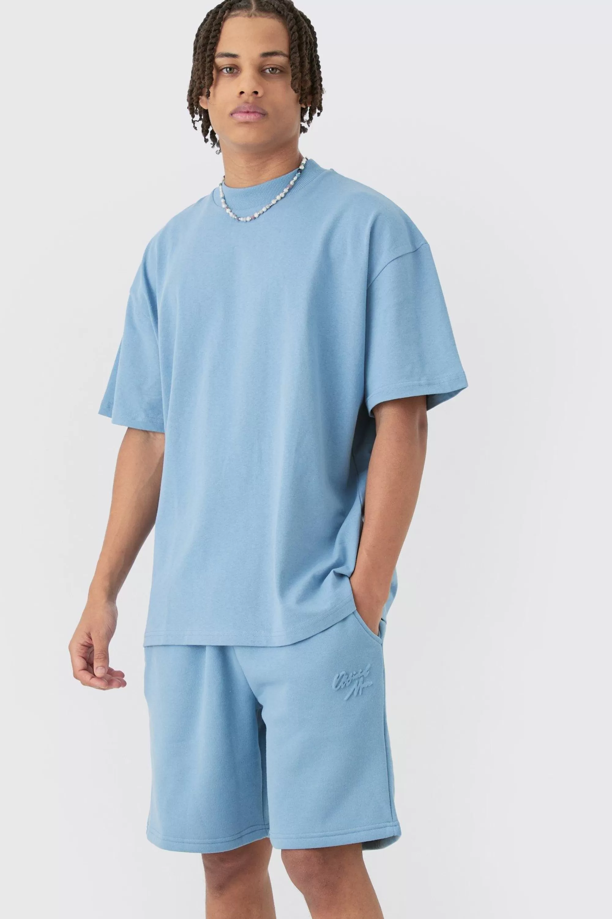 boohooMAN Oversized Extended Neck Official Man Embossed T-shirt & Short Set | UK