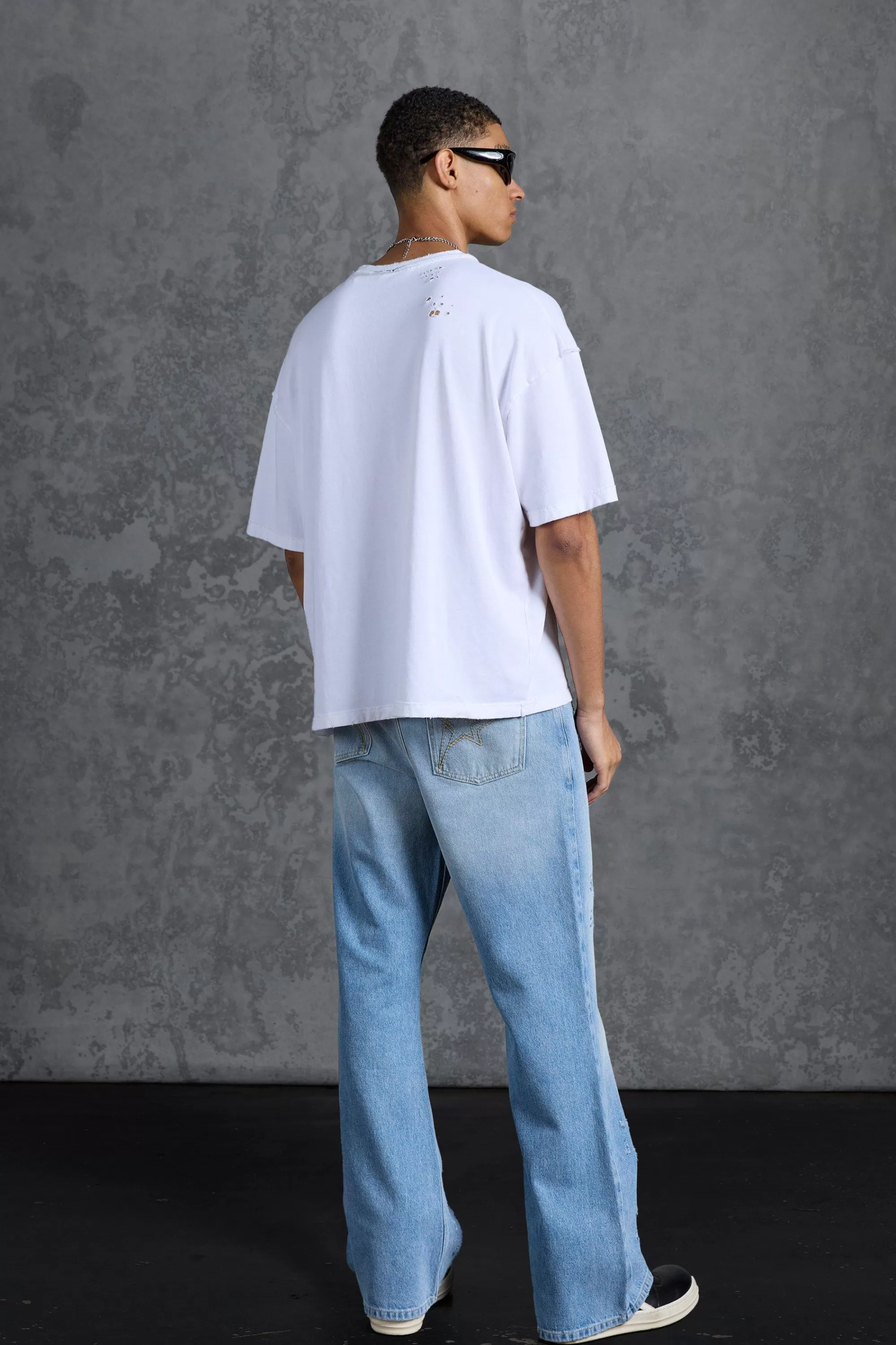 boohooMAN P-Star Slim Fit Flare Stacked Jeans With Distressing | UK