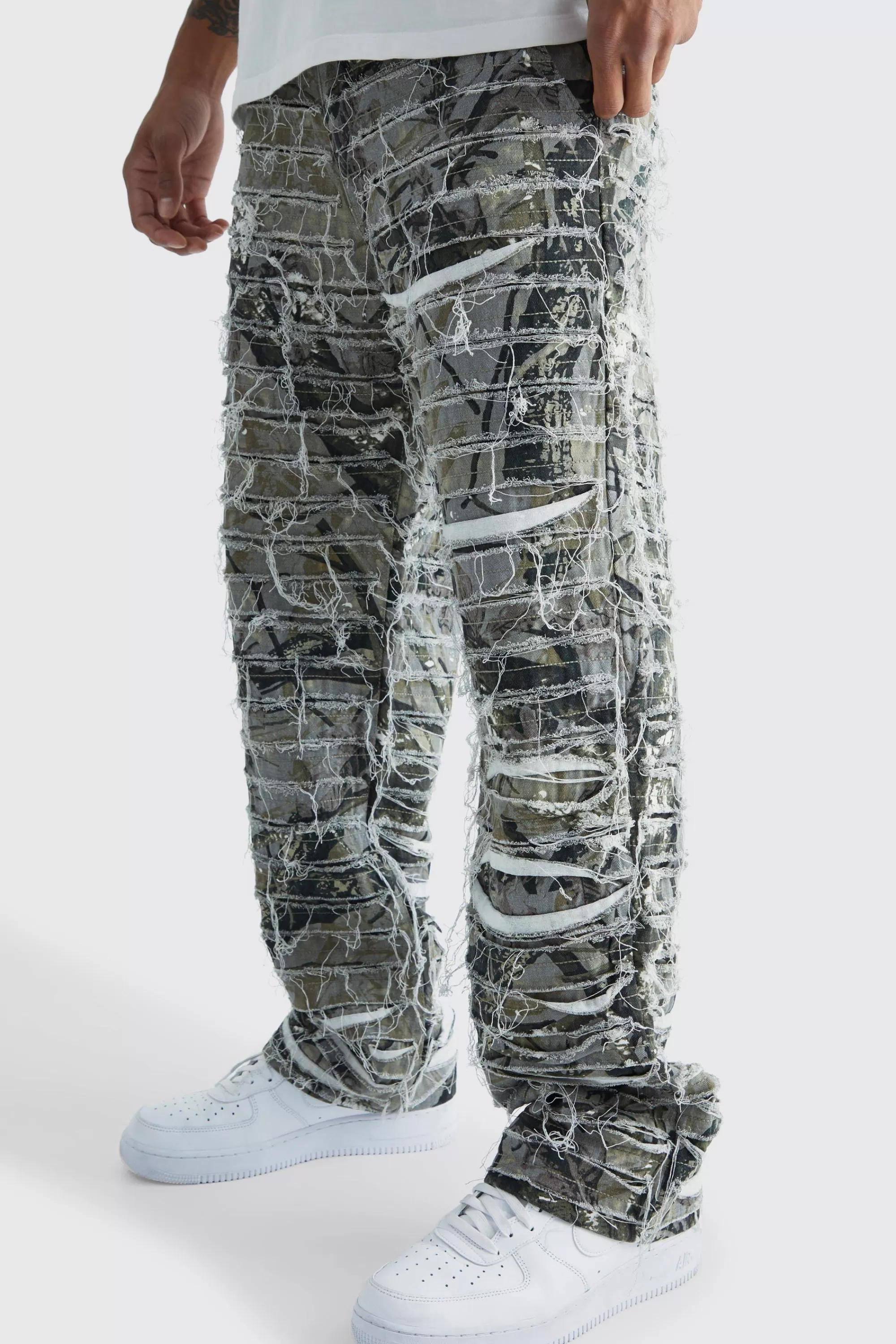 boohooMAN Relaxed Heavily Distressed Camo Trouser | UK