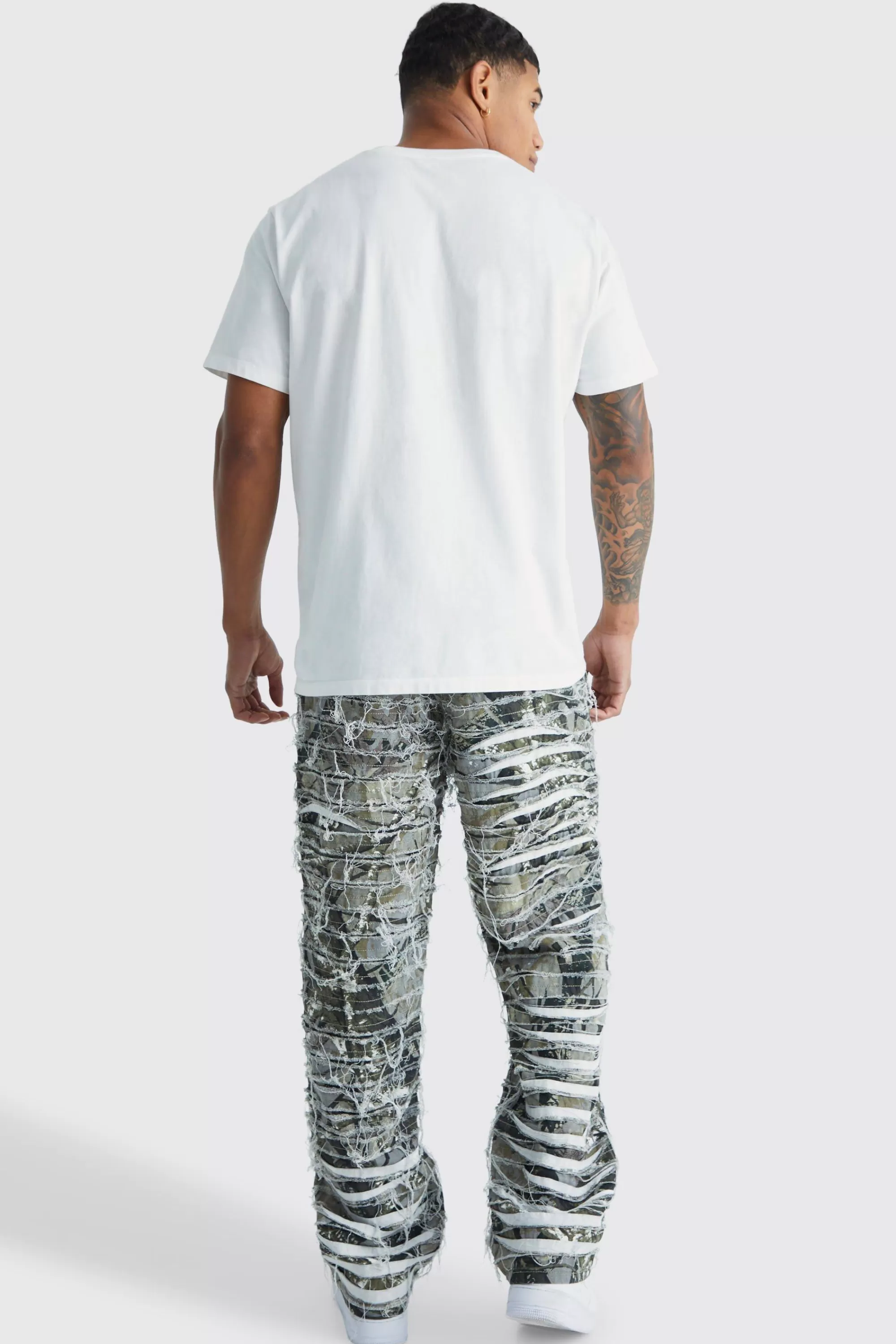 boohooMAN Relaxed Heavily Distressed Camo Trouser | UK